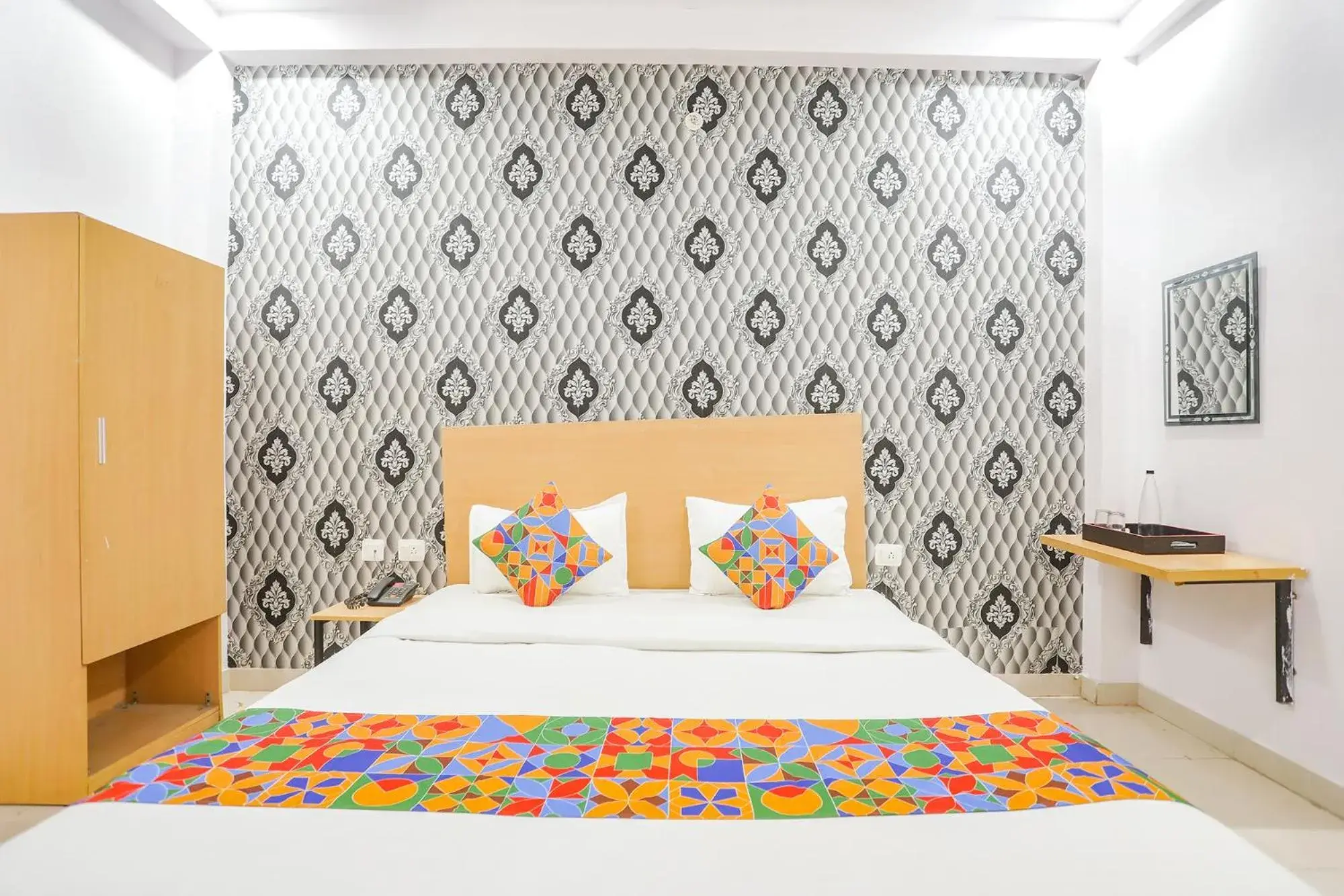 Bed in FabHotel Pranjul Inn Bed in FabHotel Pranjul Inn