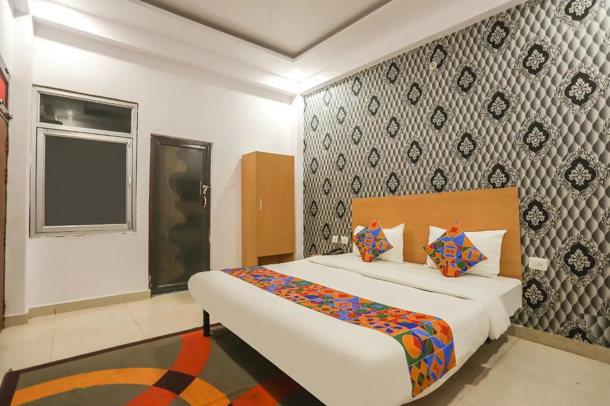 Bed in FabHotel Pranjul Inn Bed in FabHotel Pranjul Inn