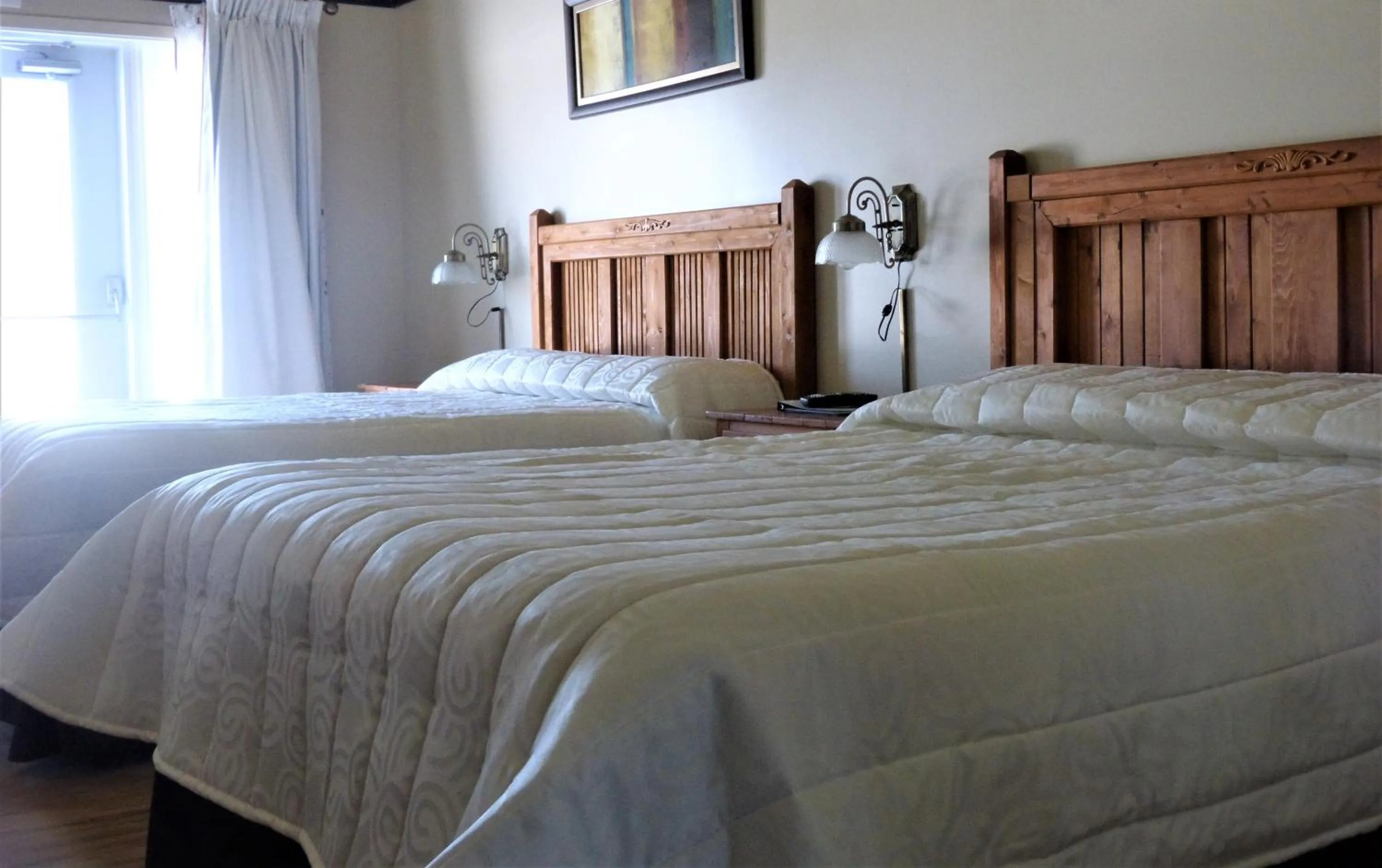 Bed in Auberge Du Lac Malcom