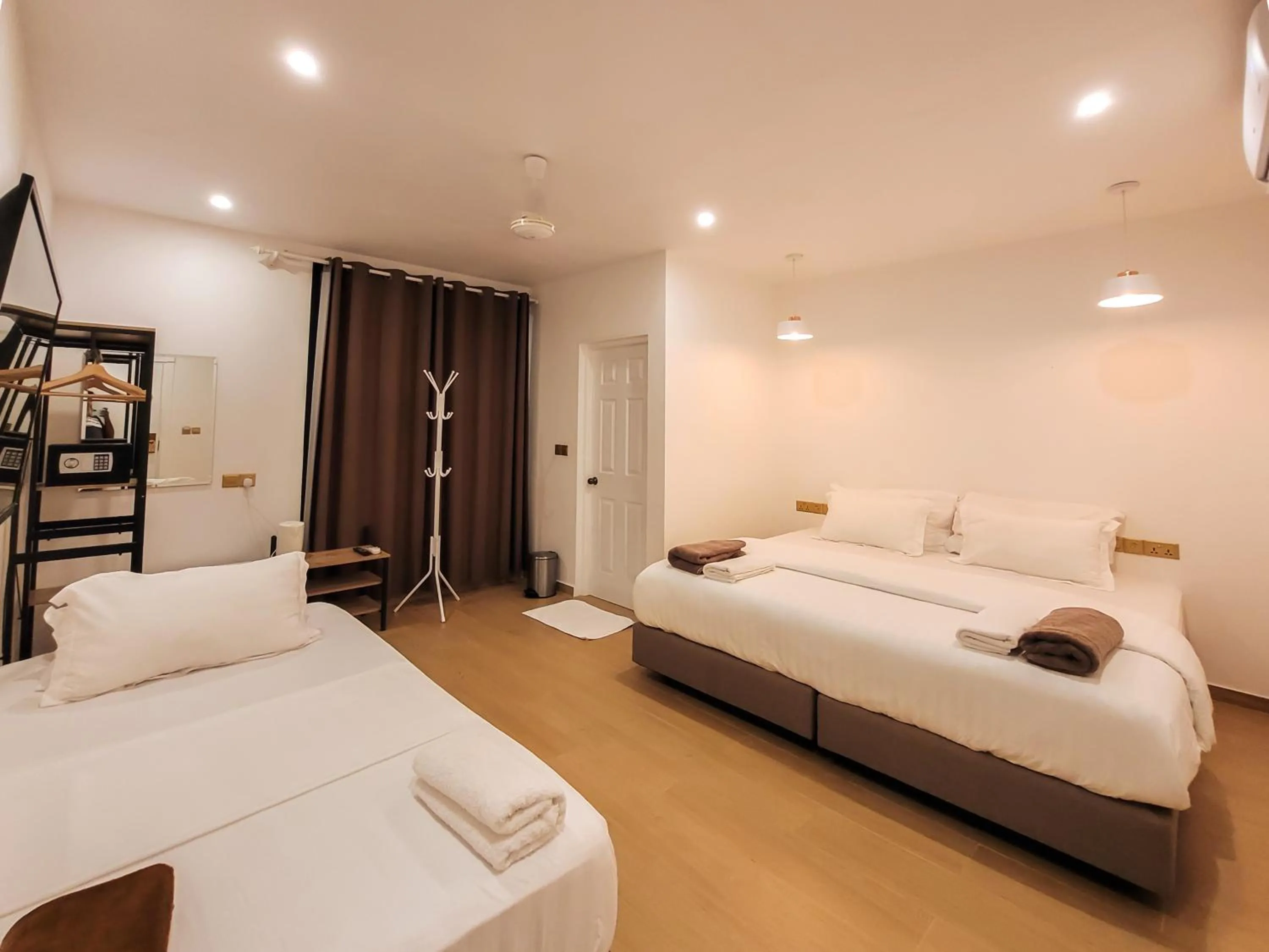 Photo of the whole room, Bed in KingsWay Thoddoo Maldives