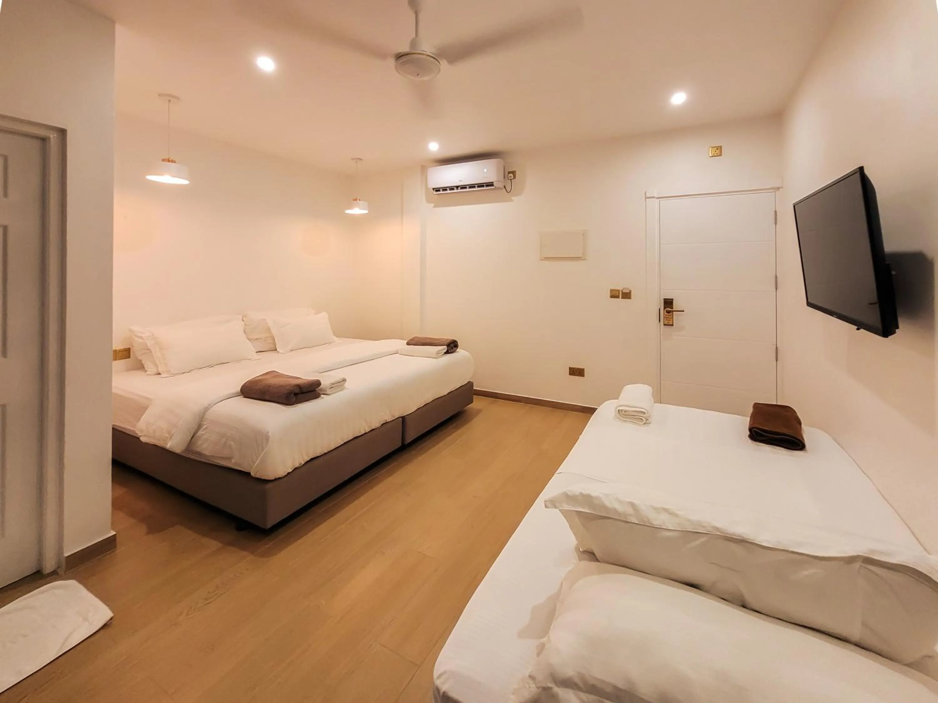 Photo of the whole room, Bed in KingsWay Thoddoo Maldives