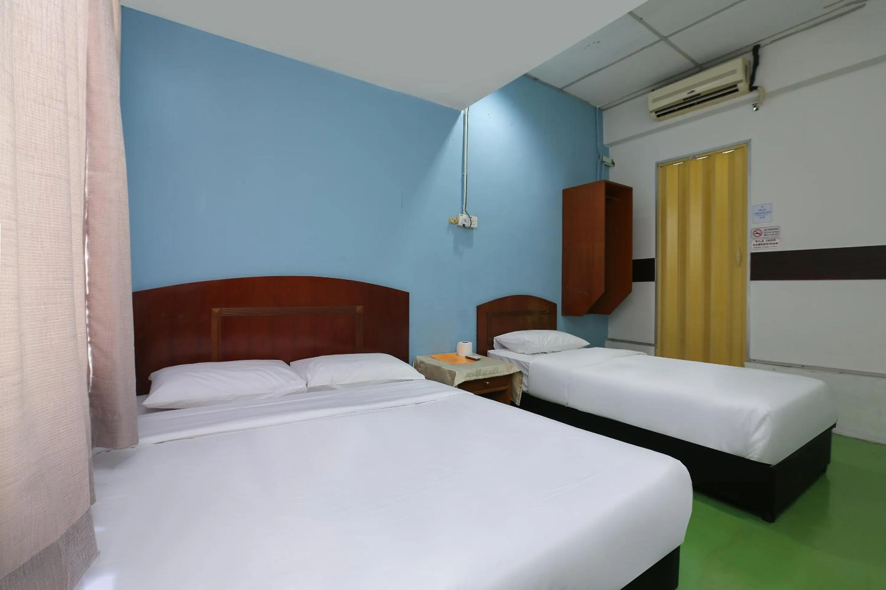 Bed in Impiana Hotel