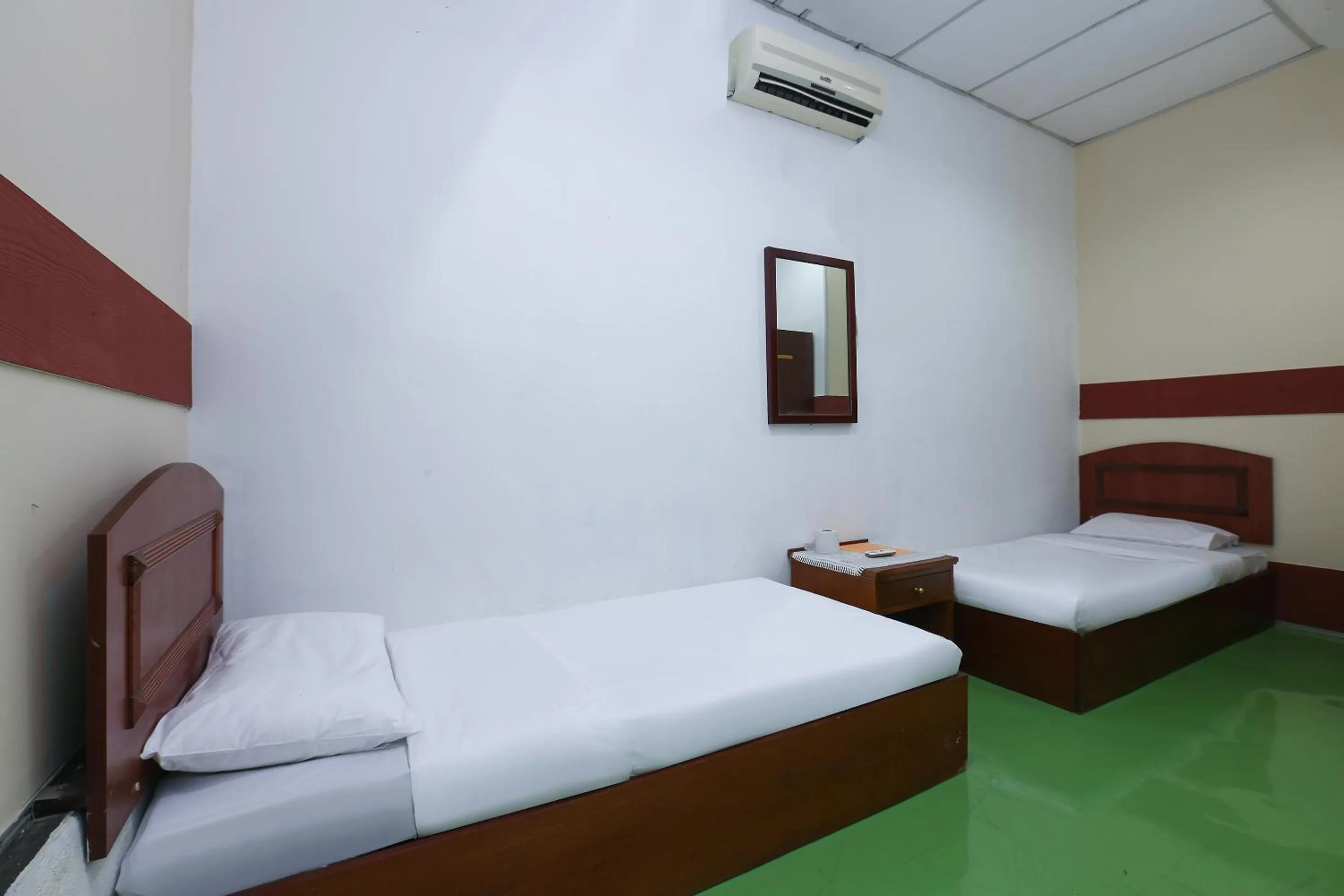 Bed in Impiana Hotel