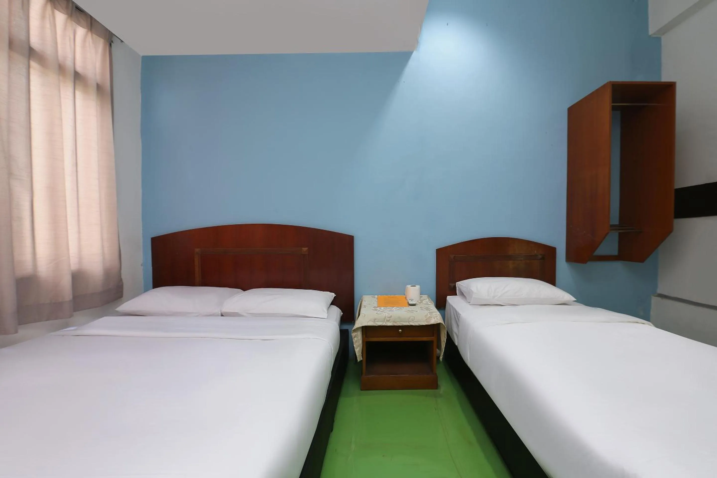 Bed in Impiana Hotel