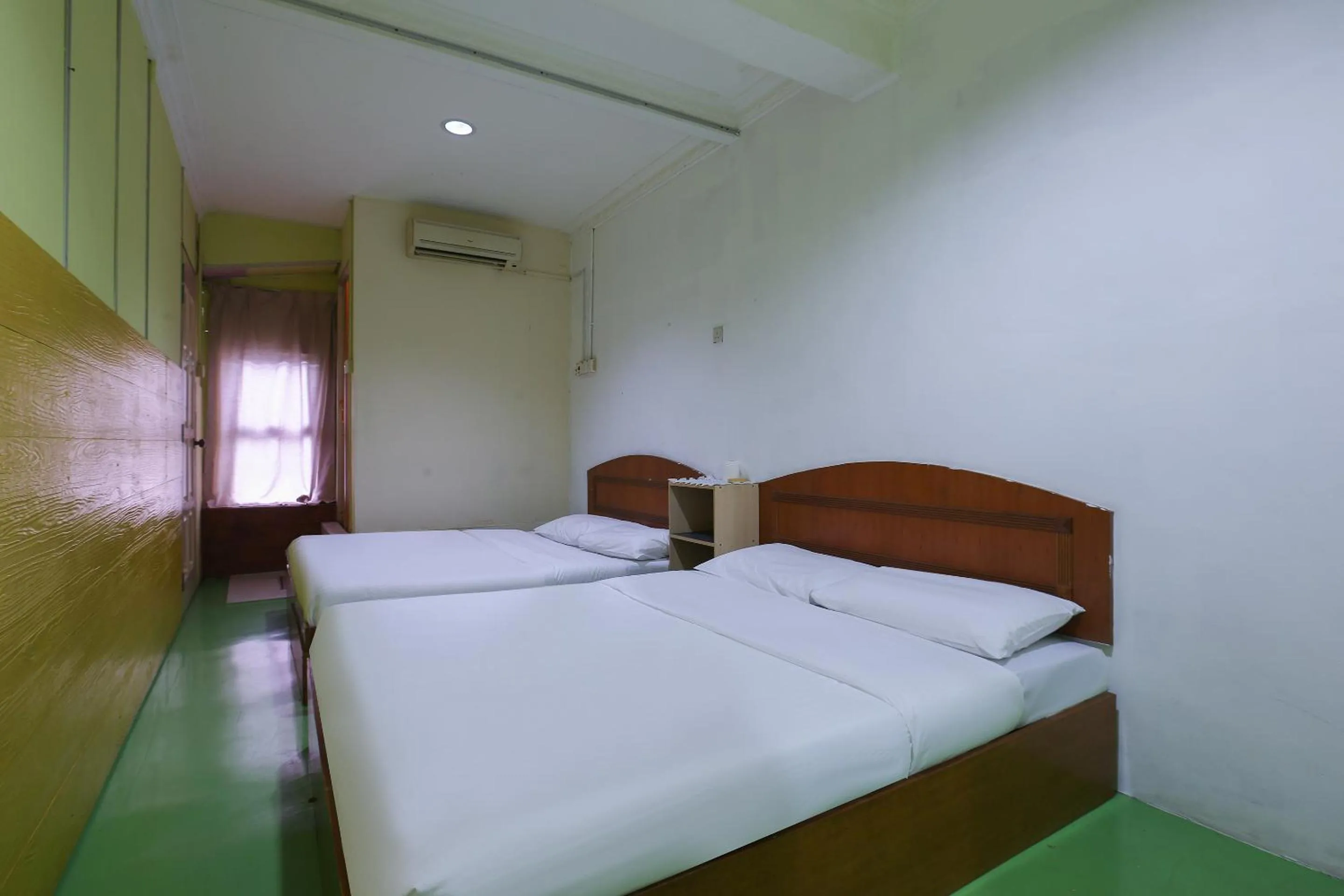 Bed in Impiana Hotel