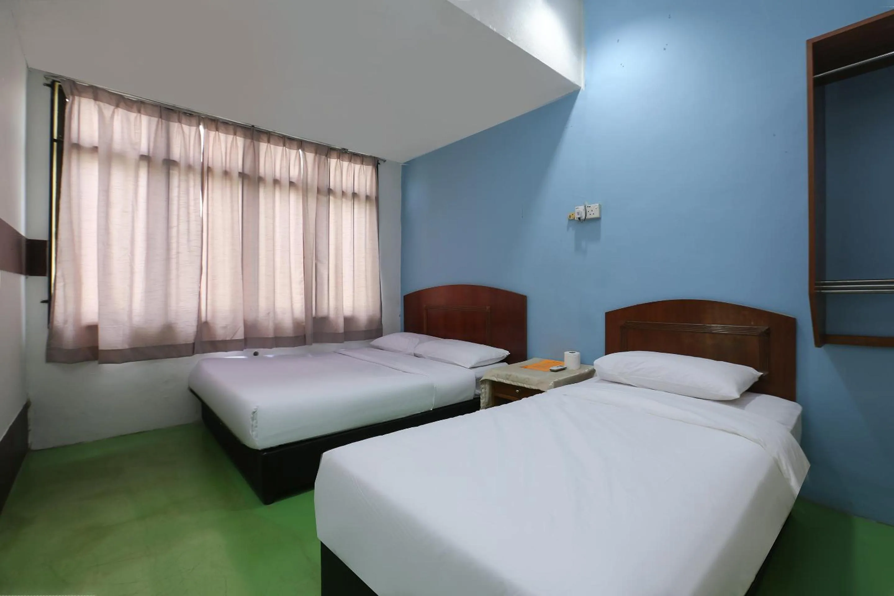 Bed in Impiana Hotel