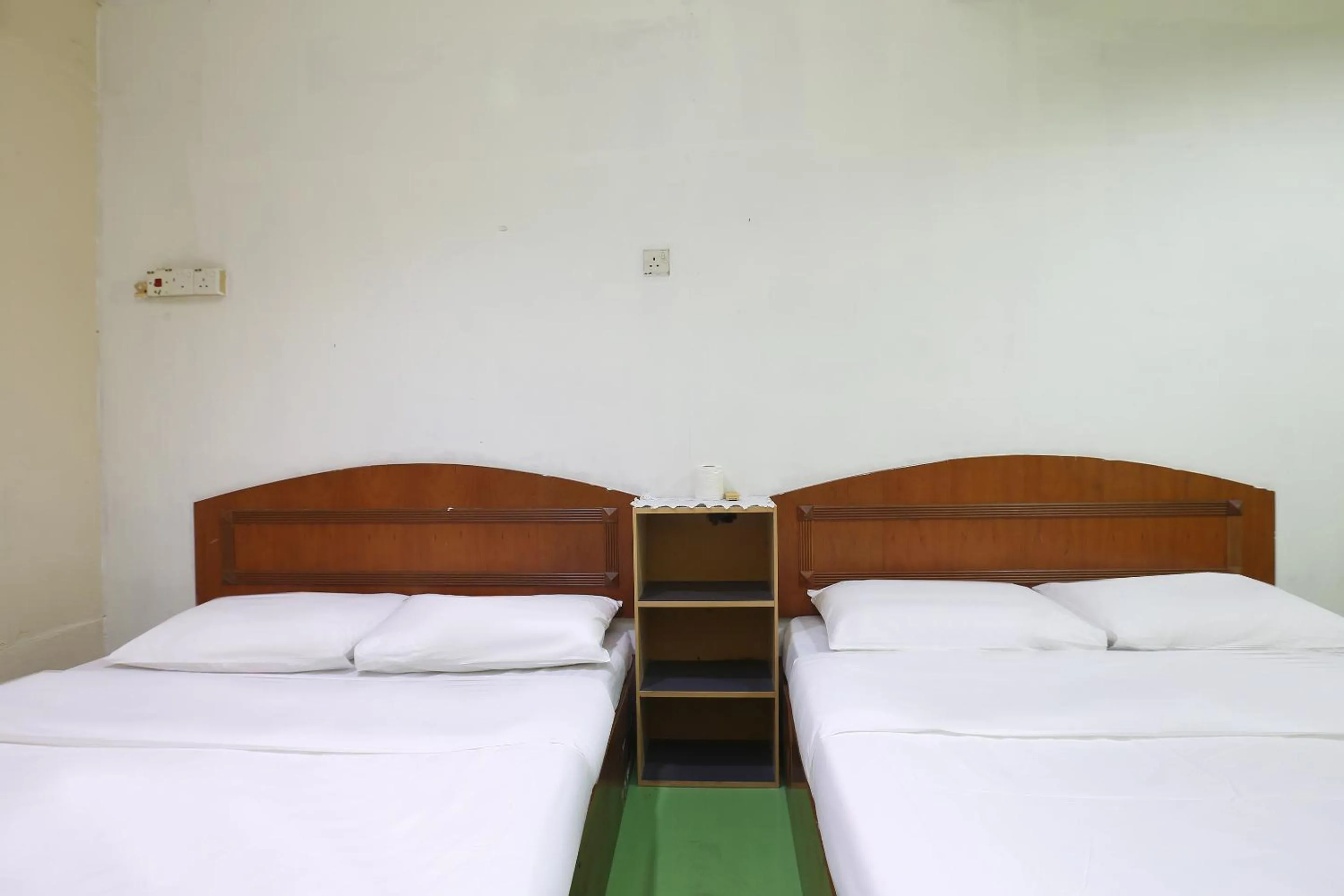 Bed in Impiana Hotel