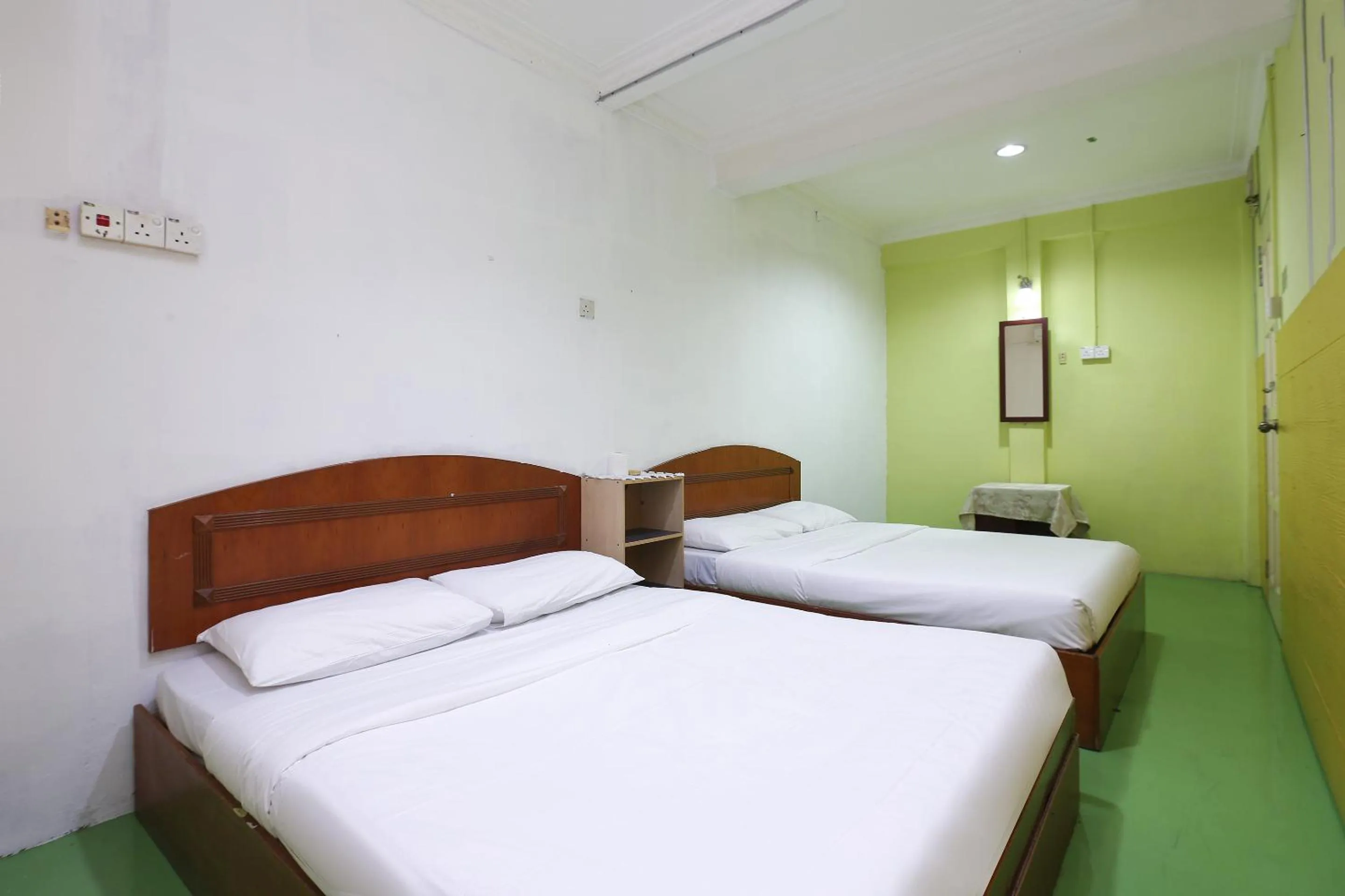 Bed in Impiana Hotel
