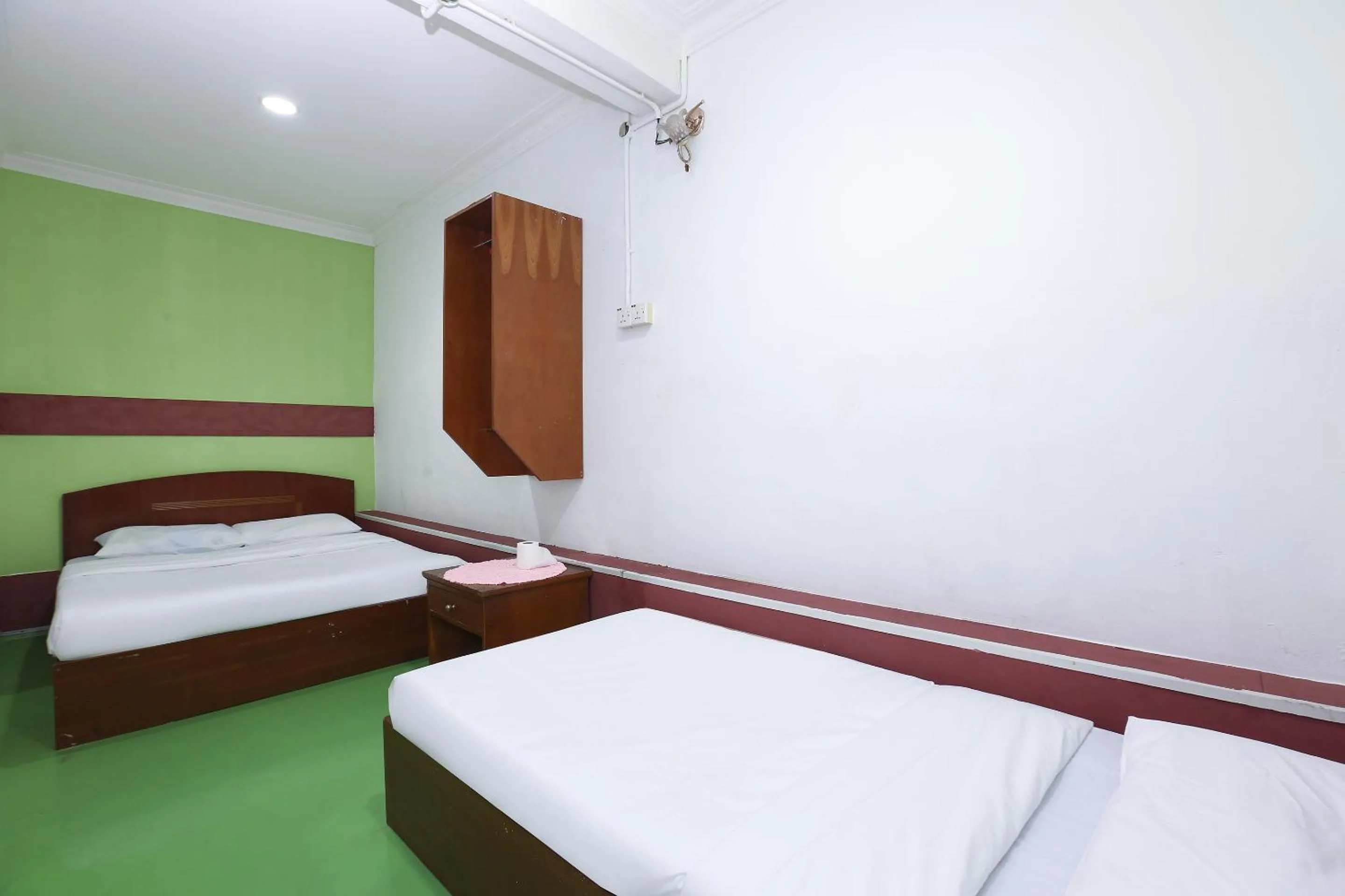 Bed in Impiana Hotel