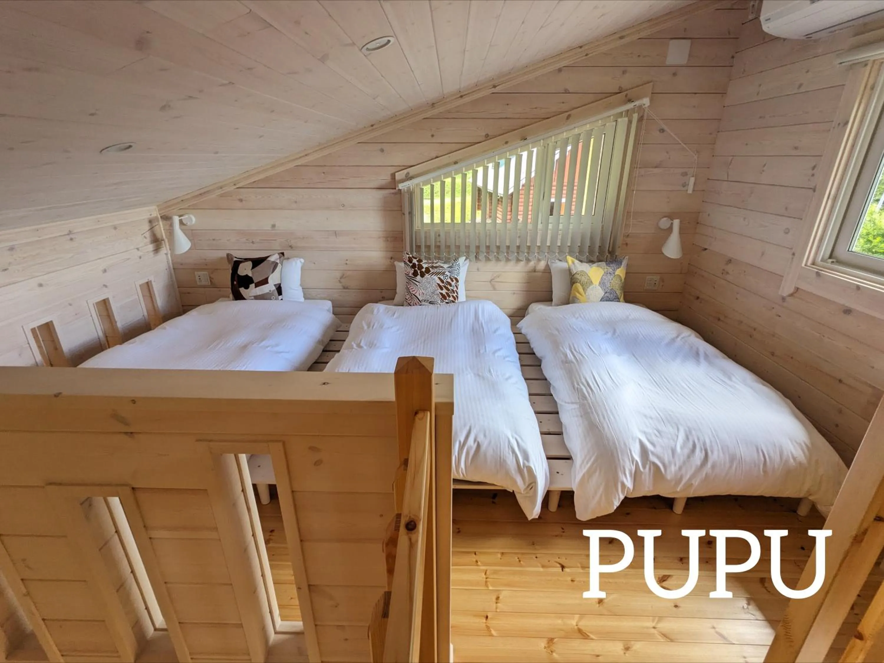 Bed in Log cabin rentals & Finland sauna Step House