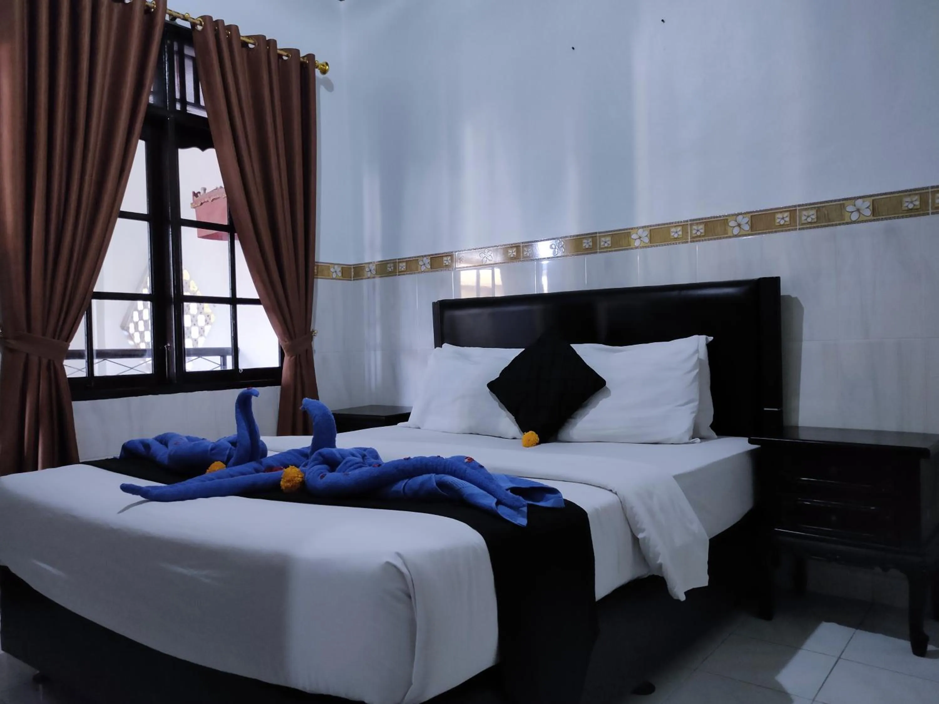 Bed in Pondok DenAyu Homestay