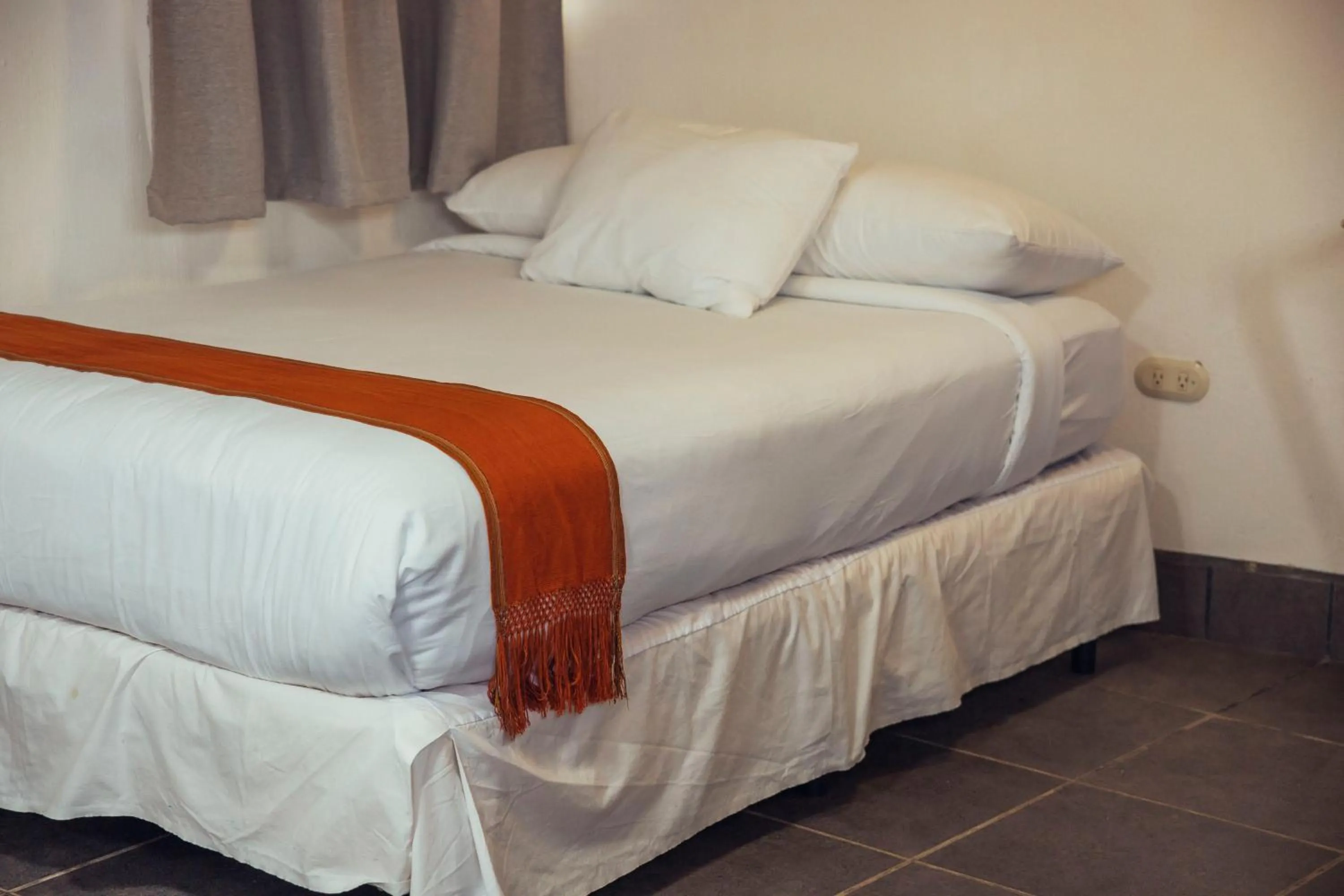 Bed in El Dragon Hotel