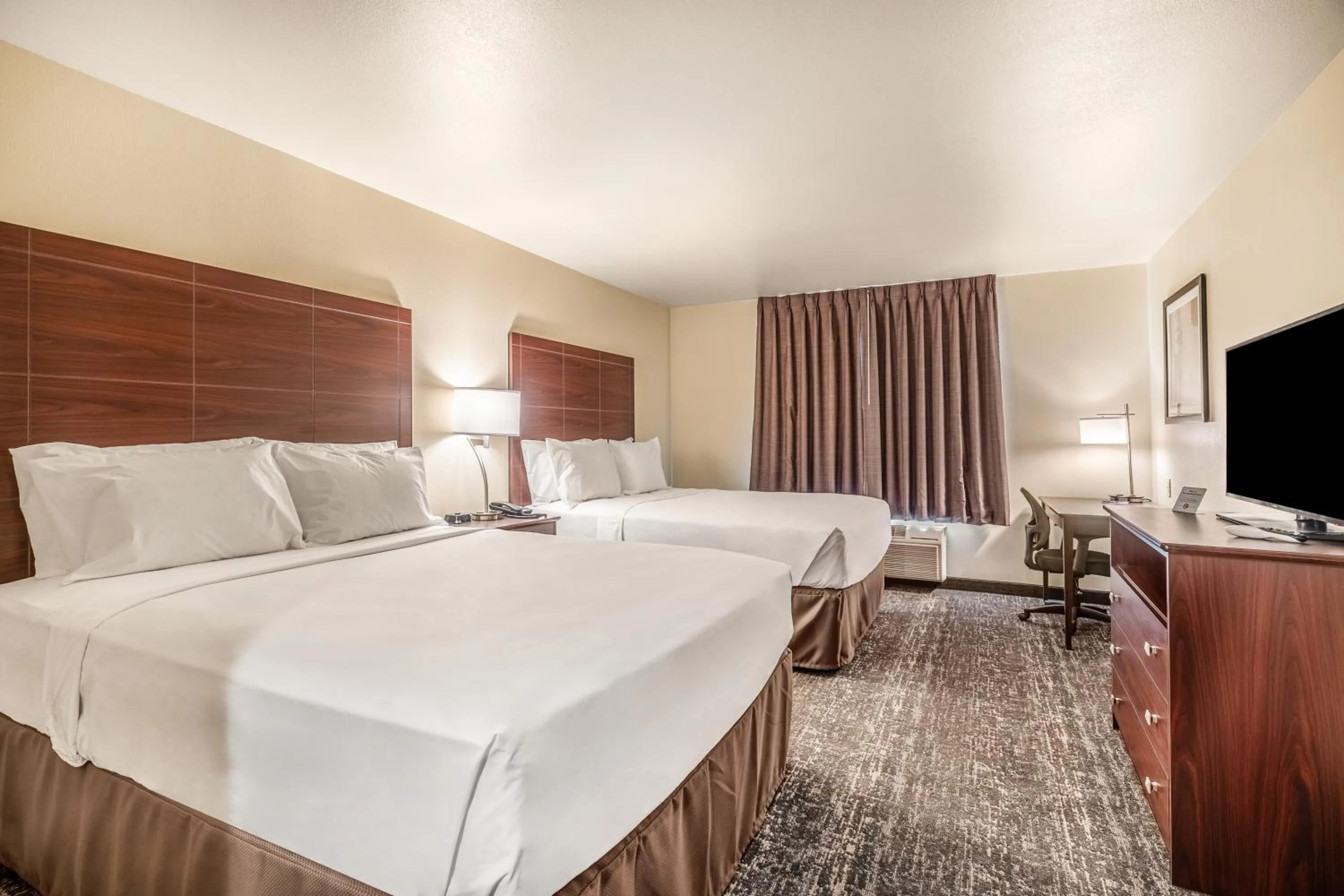 Bed in Cobblestone Hotel & Suites - Andrews