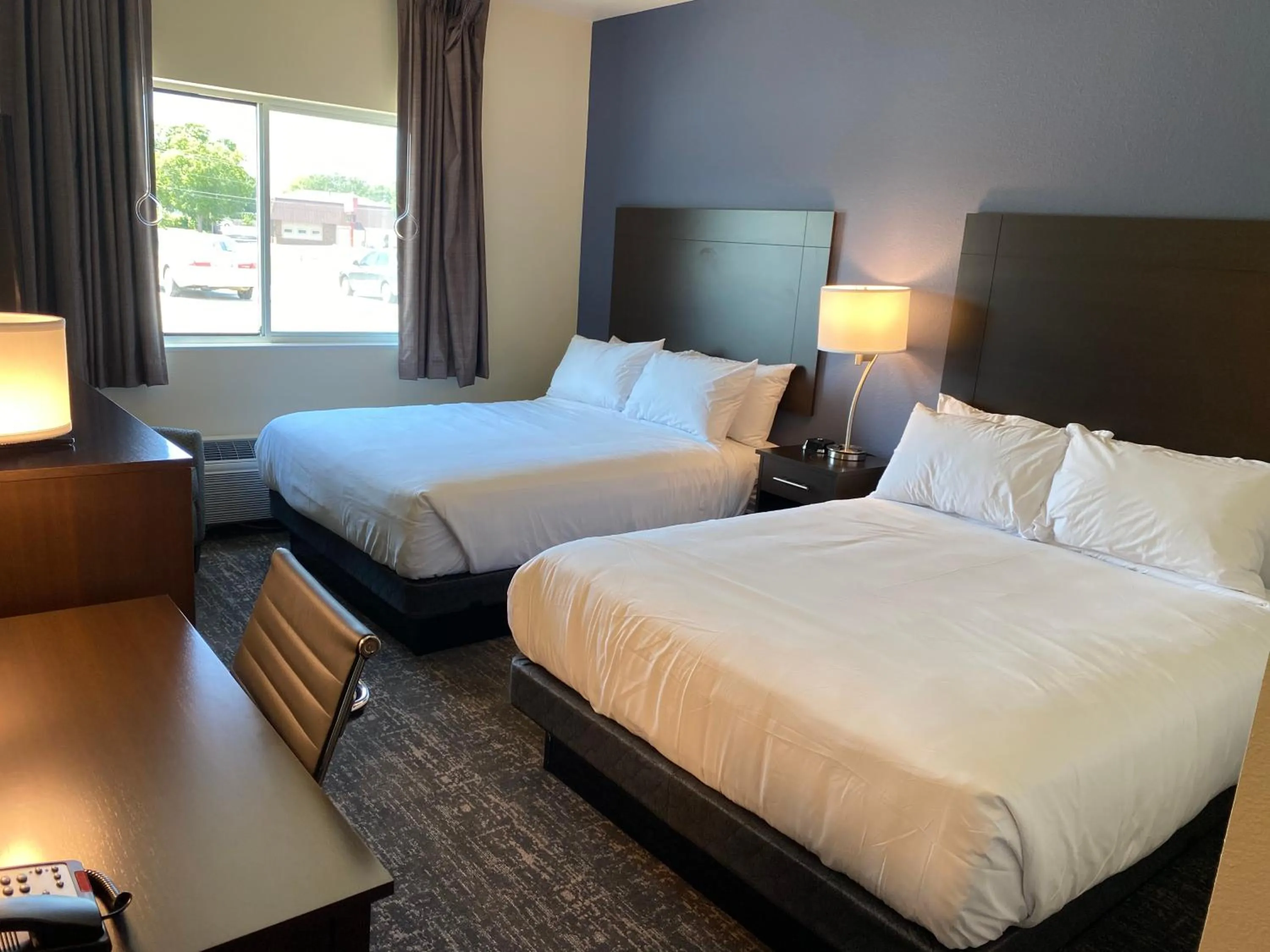 Bed in Cobblestone Inn & Suites - Forest City