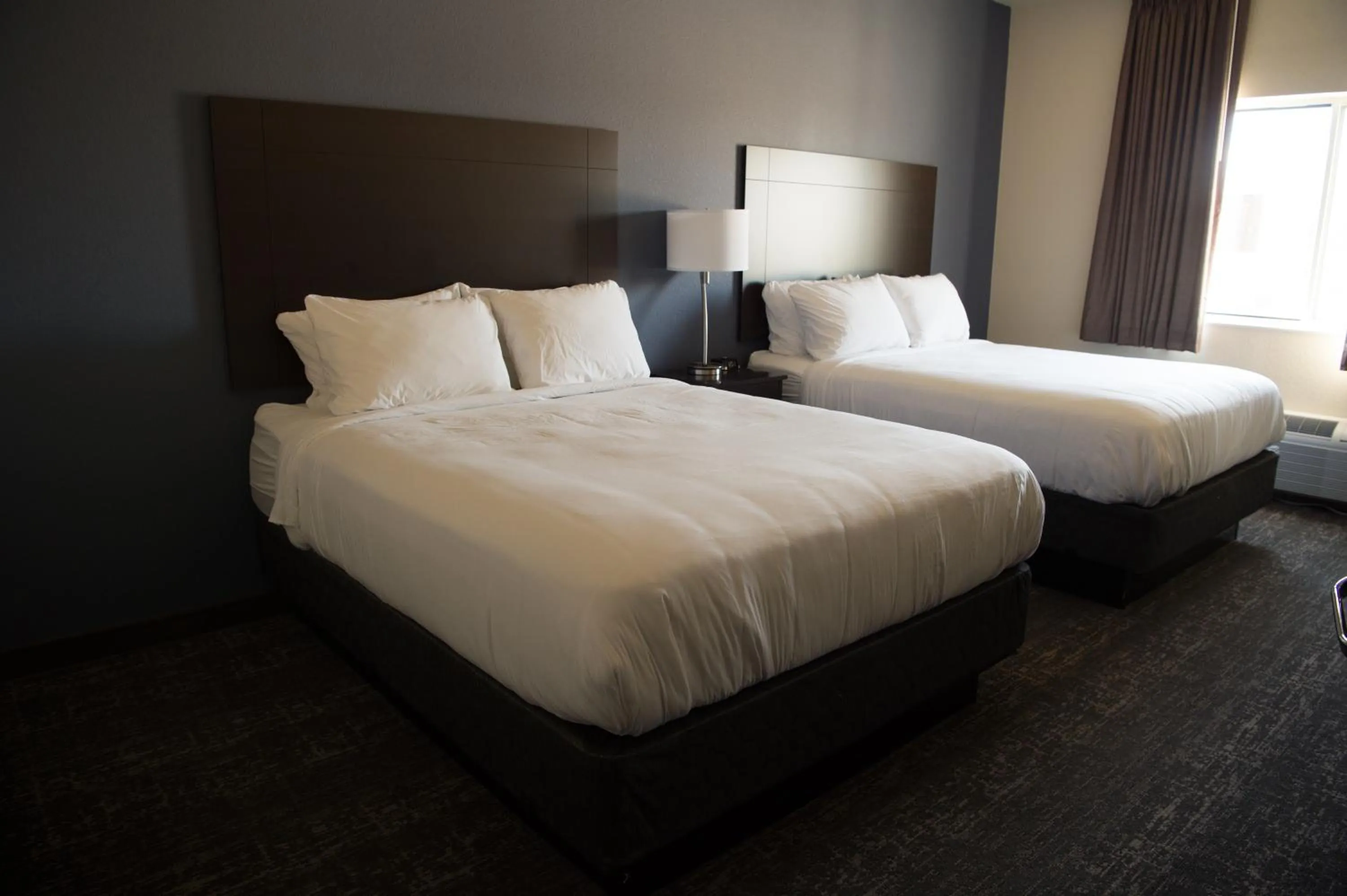 Bed in Cobblestone Inn & Suites - Forest City