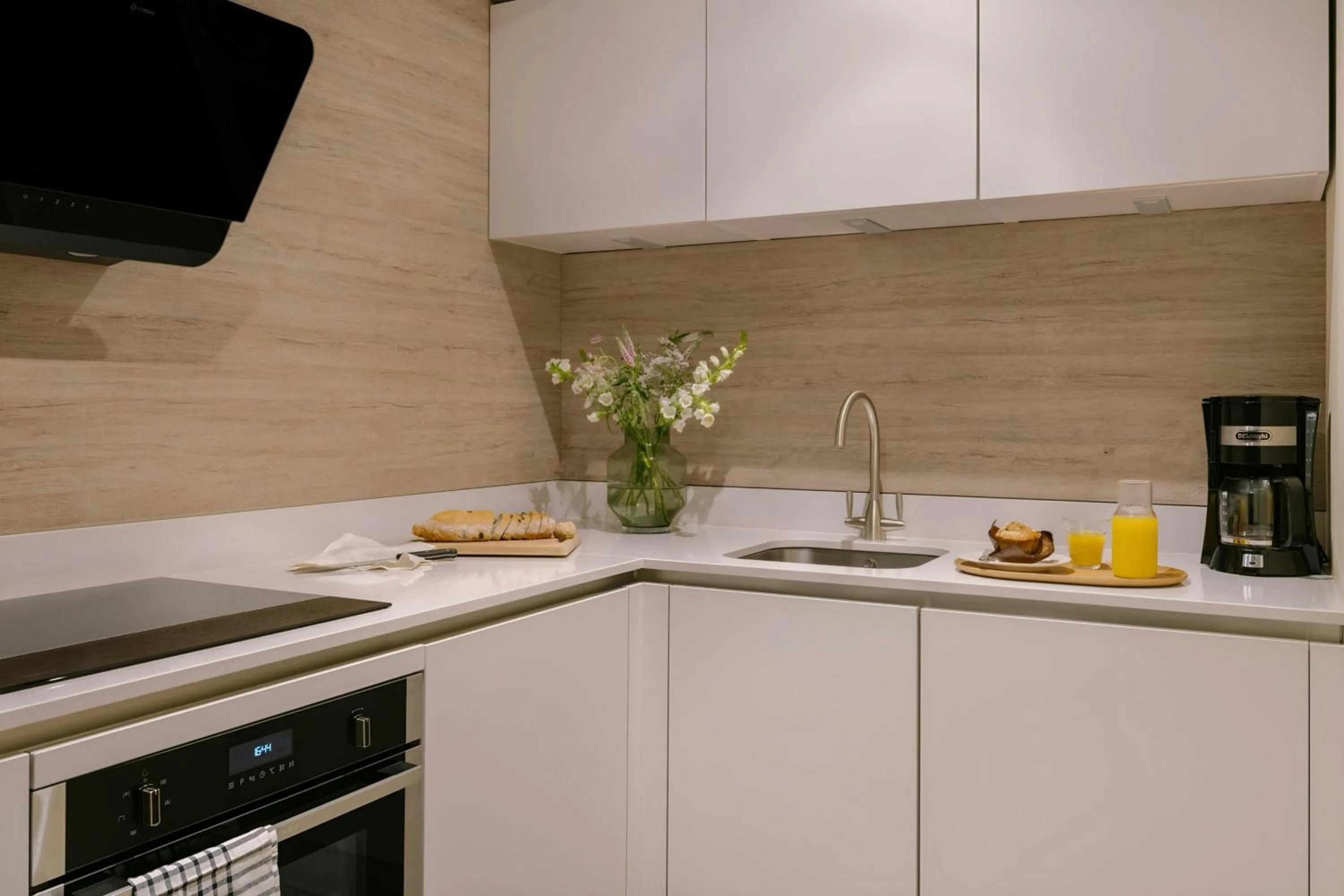 Kitchen or kitchenette in Sonder by Marriott Bonvoy Royal Garden Apartments New Town