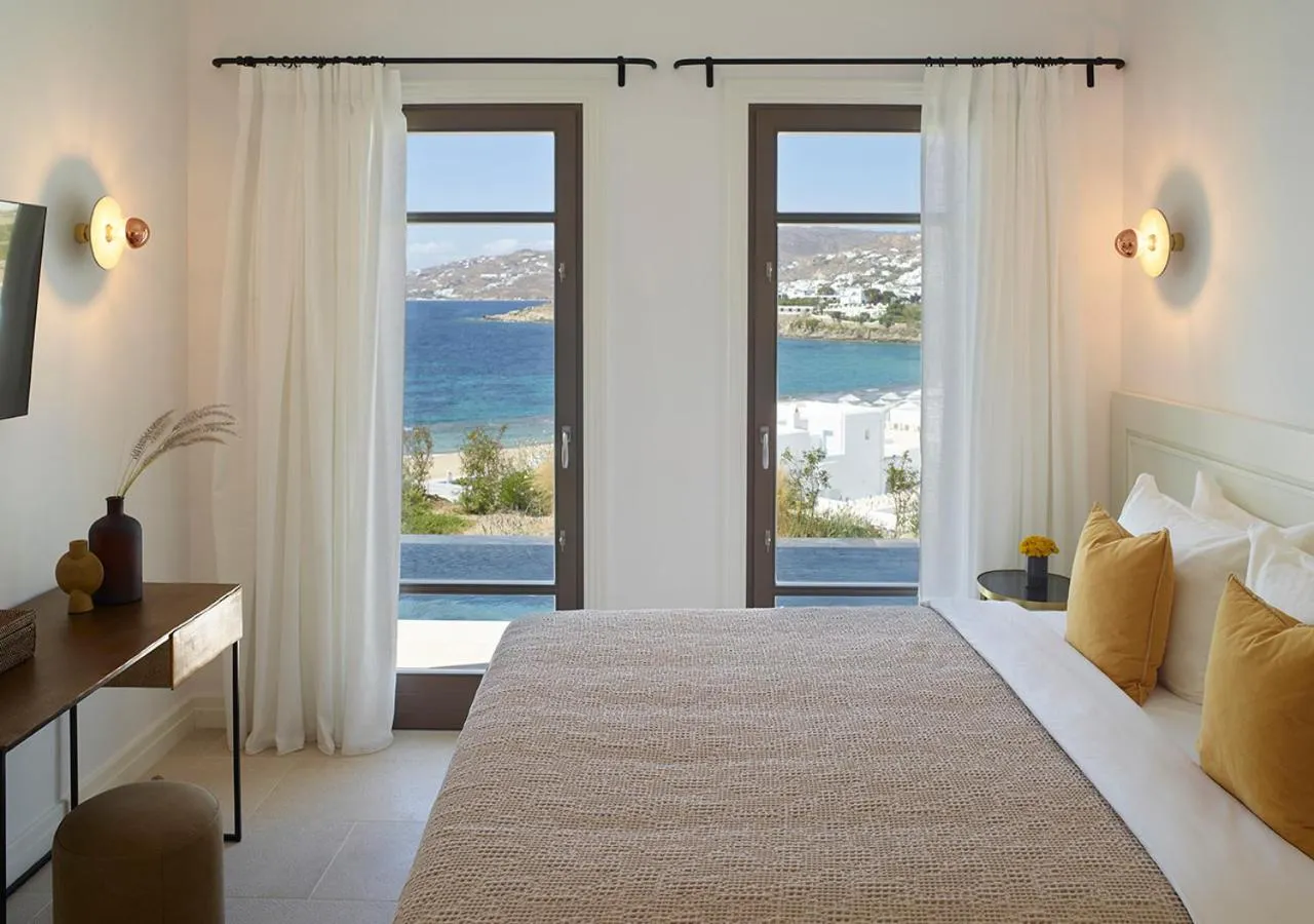 Bed in Bonzoe Suites & Villas