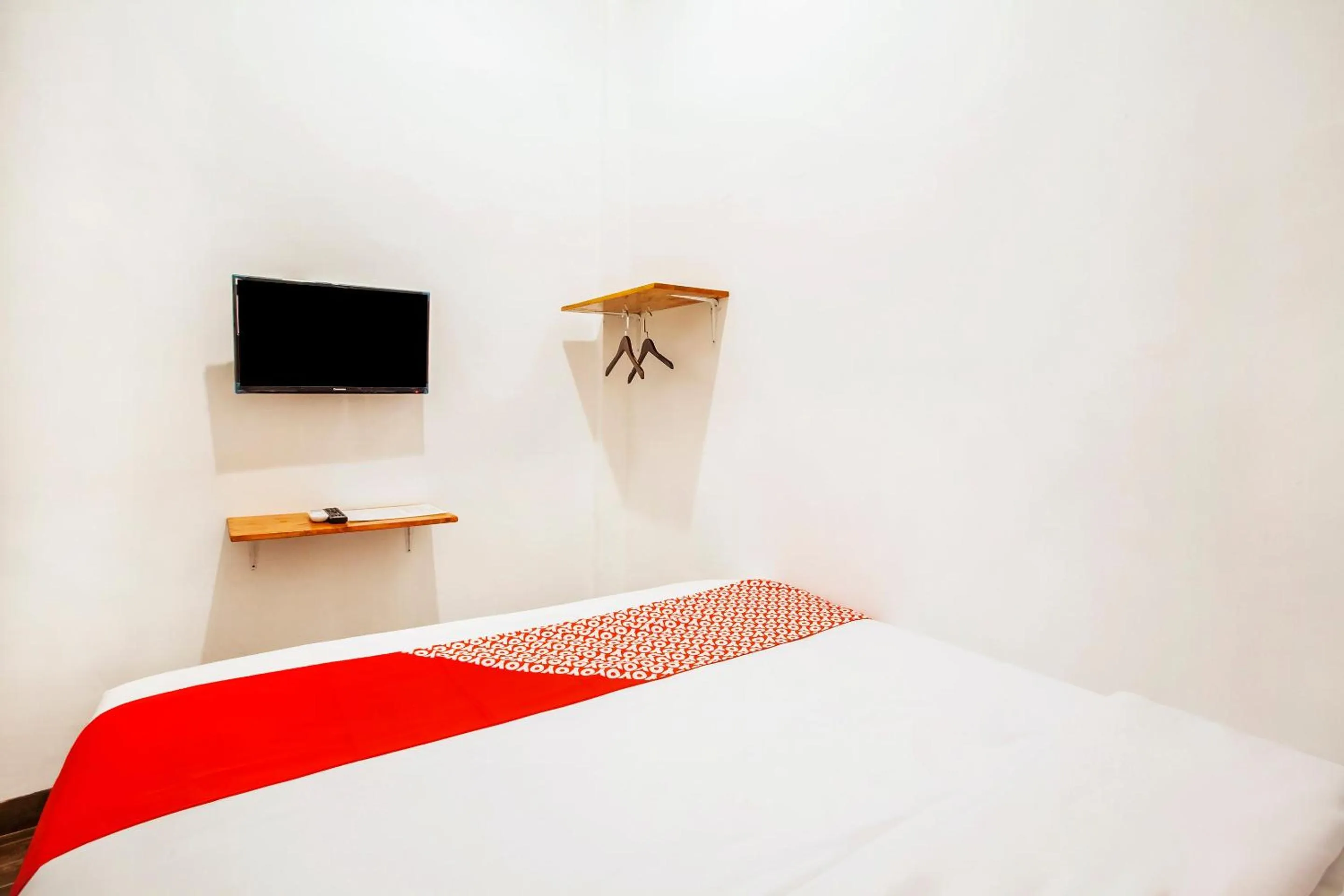 Bedroom in Hotel O Sutomo Inn