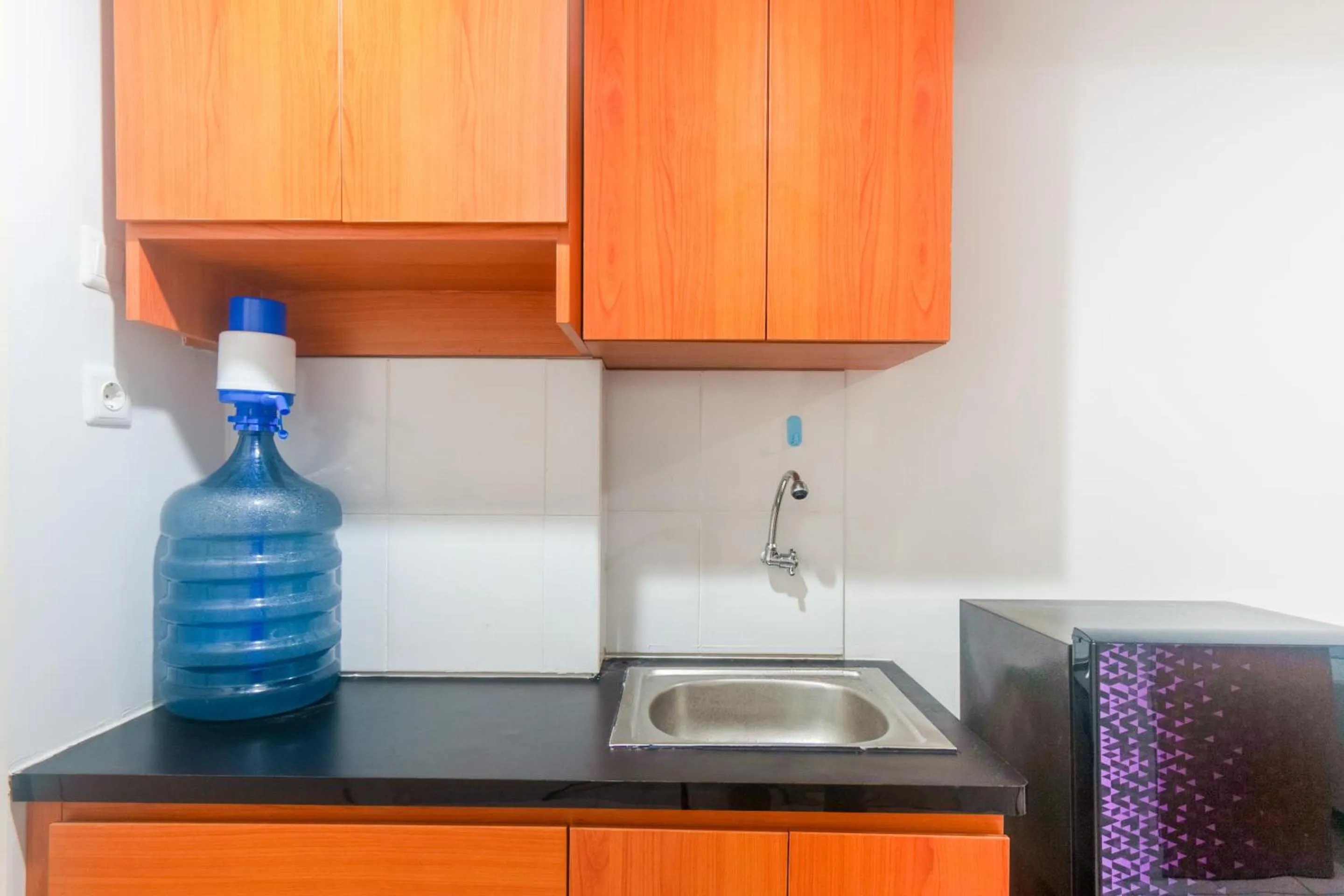 Kitchen or kitchenette in OYO Life 2837 Apartment Dramaga Tower