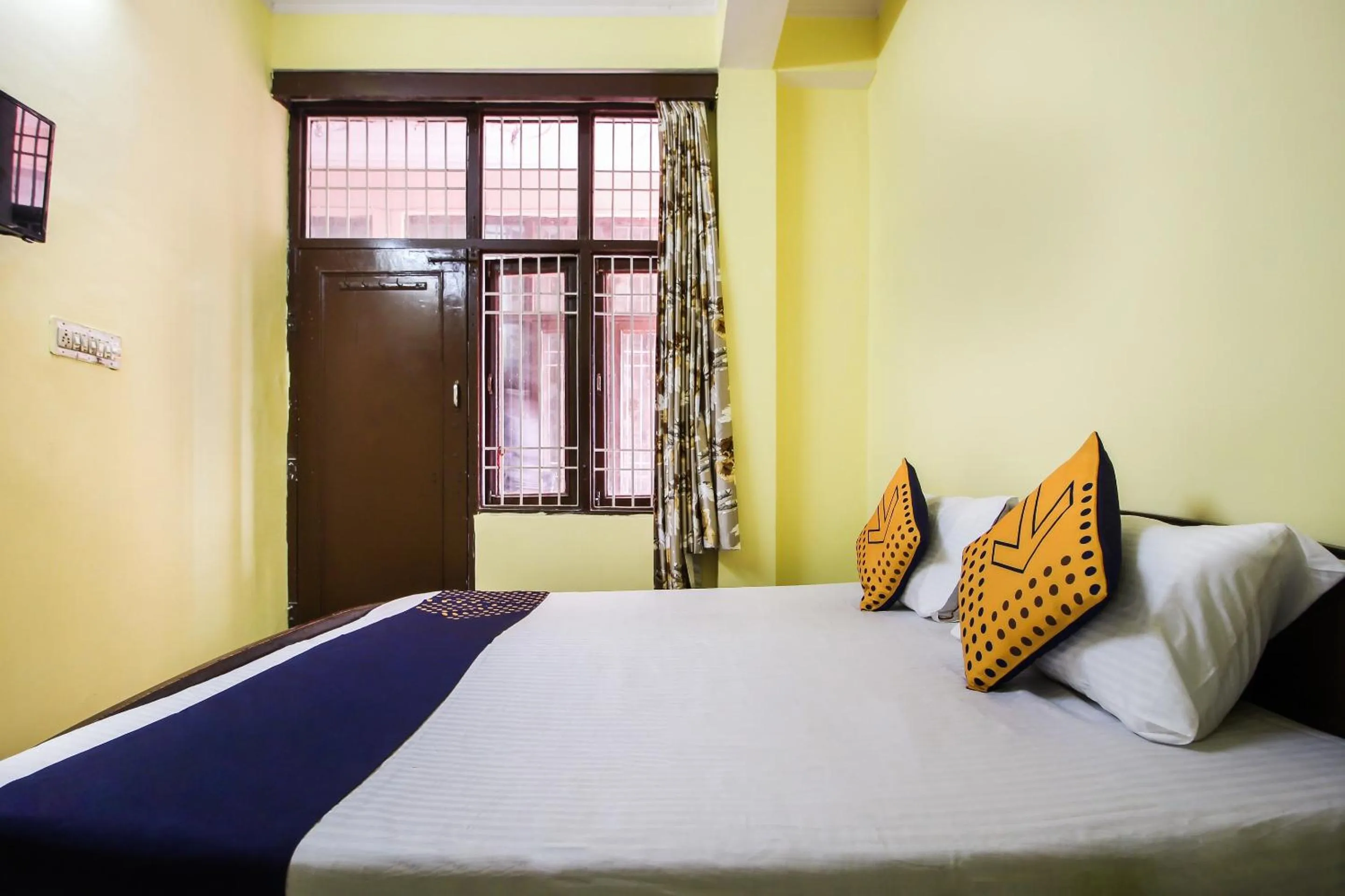 Bedroom in Collection O Hotel Kavya Guest House