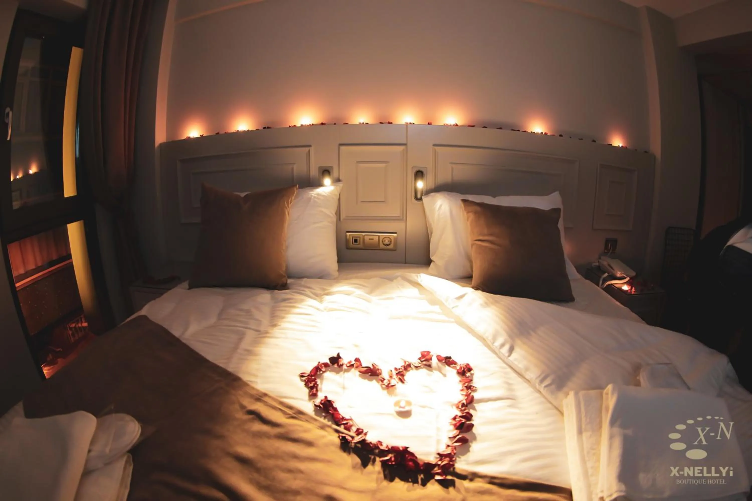 Bed in X-NELLYİ HOTEL