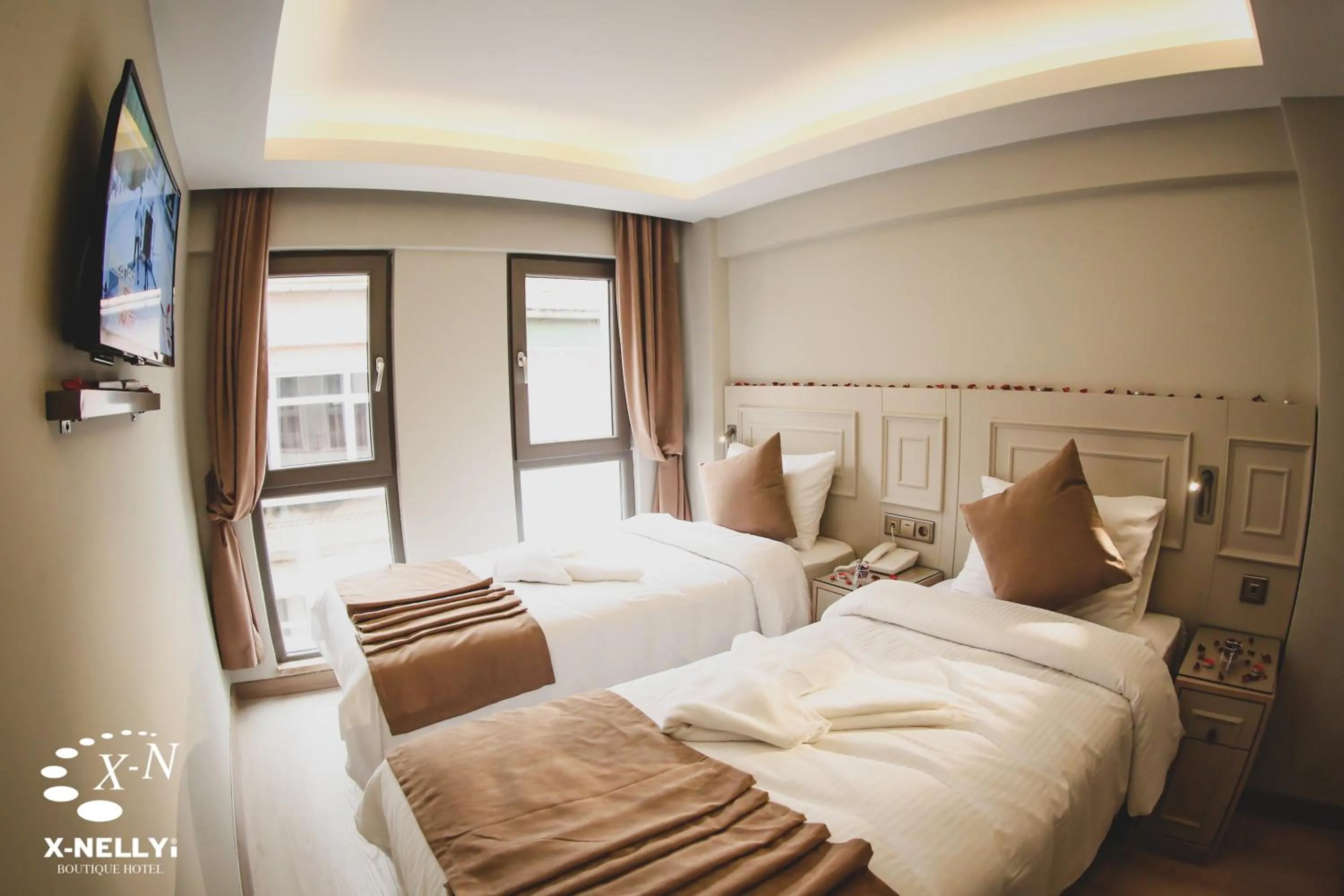 Bed in X-NELLYİ HOTEL