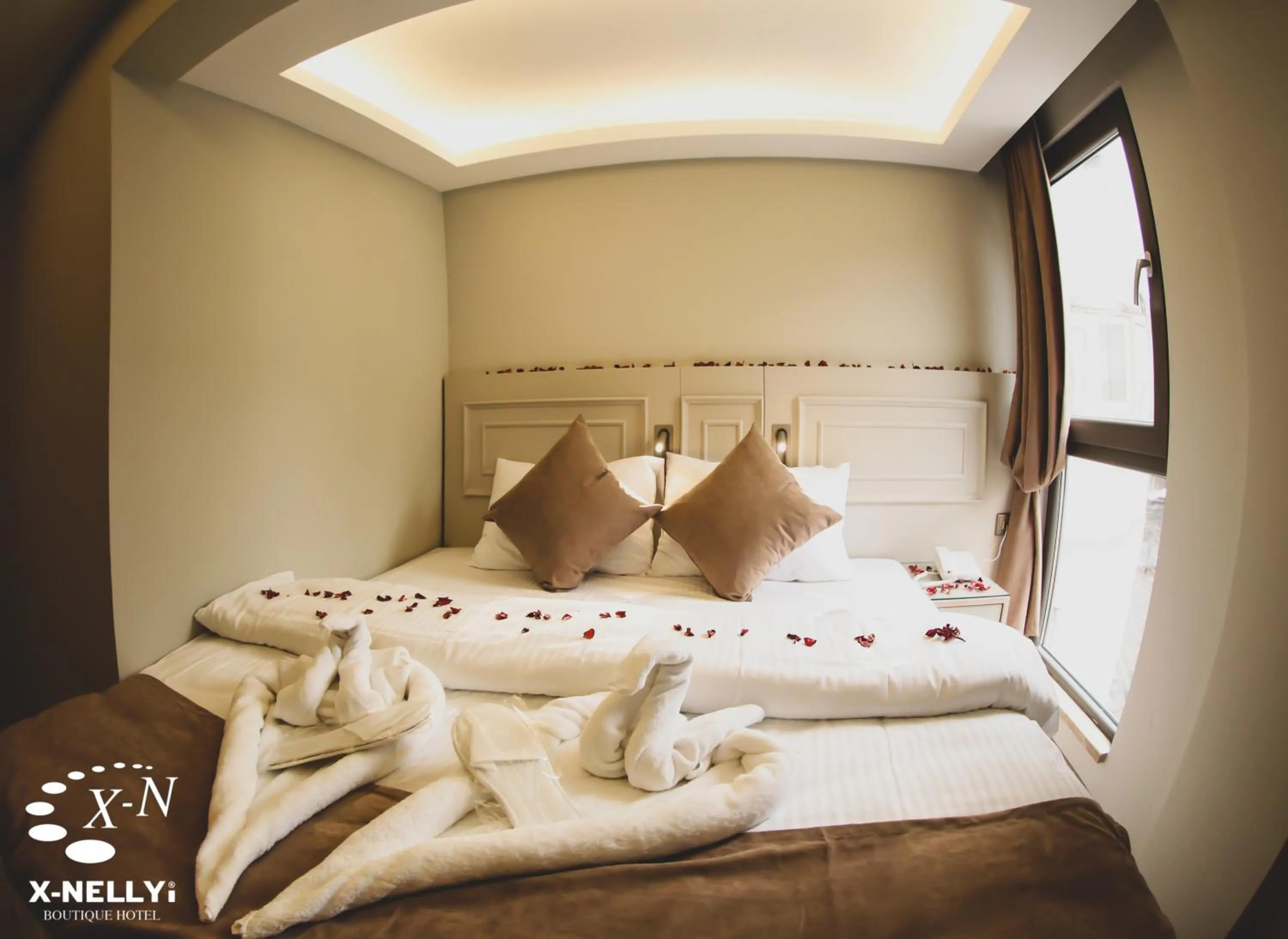 Bed in X-NELLYİ HOTEL