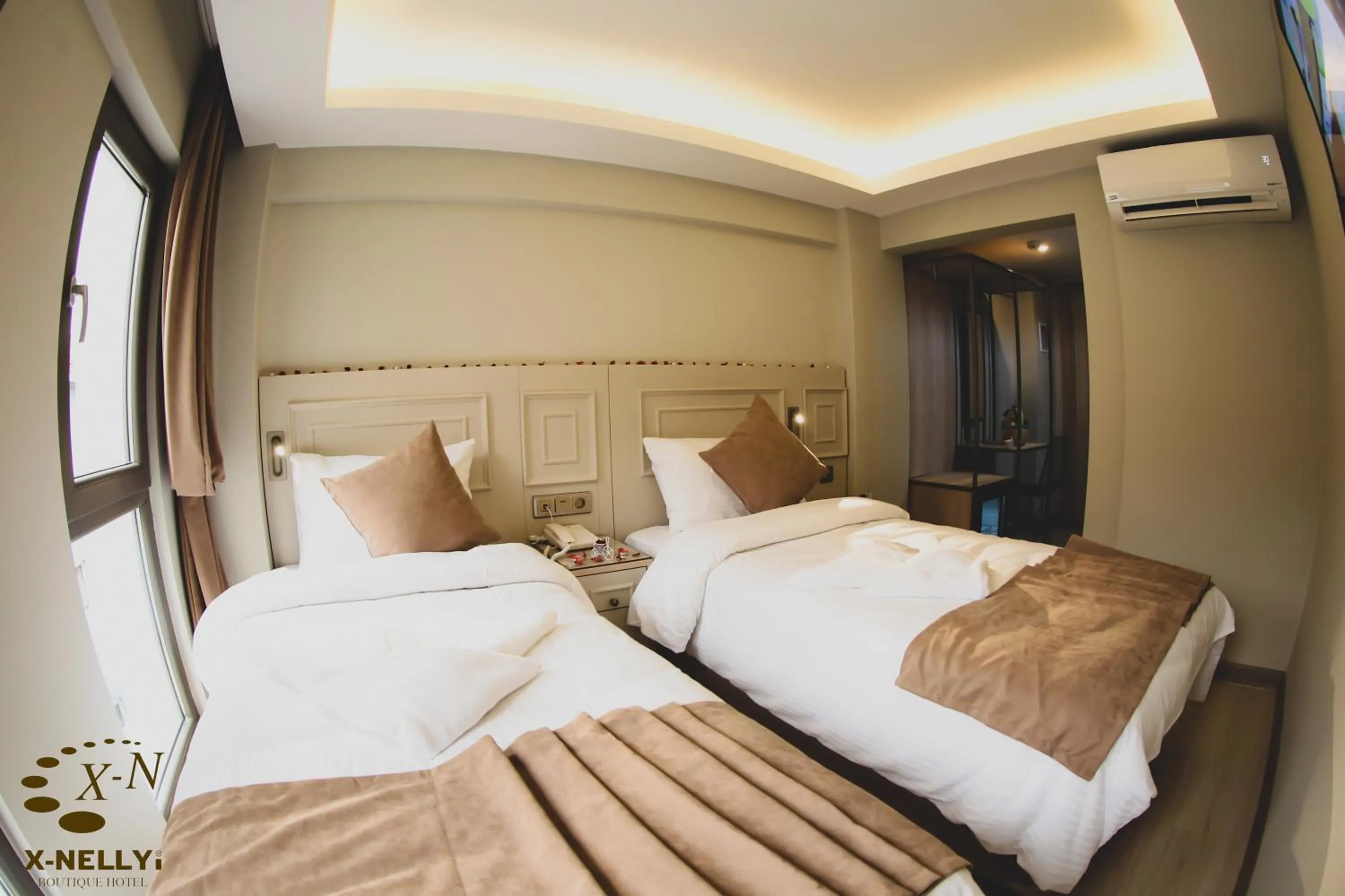 Bed in X-NELLYİ HOTEL