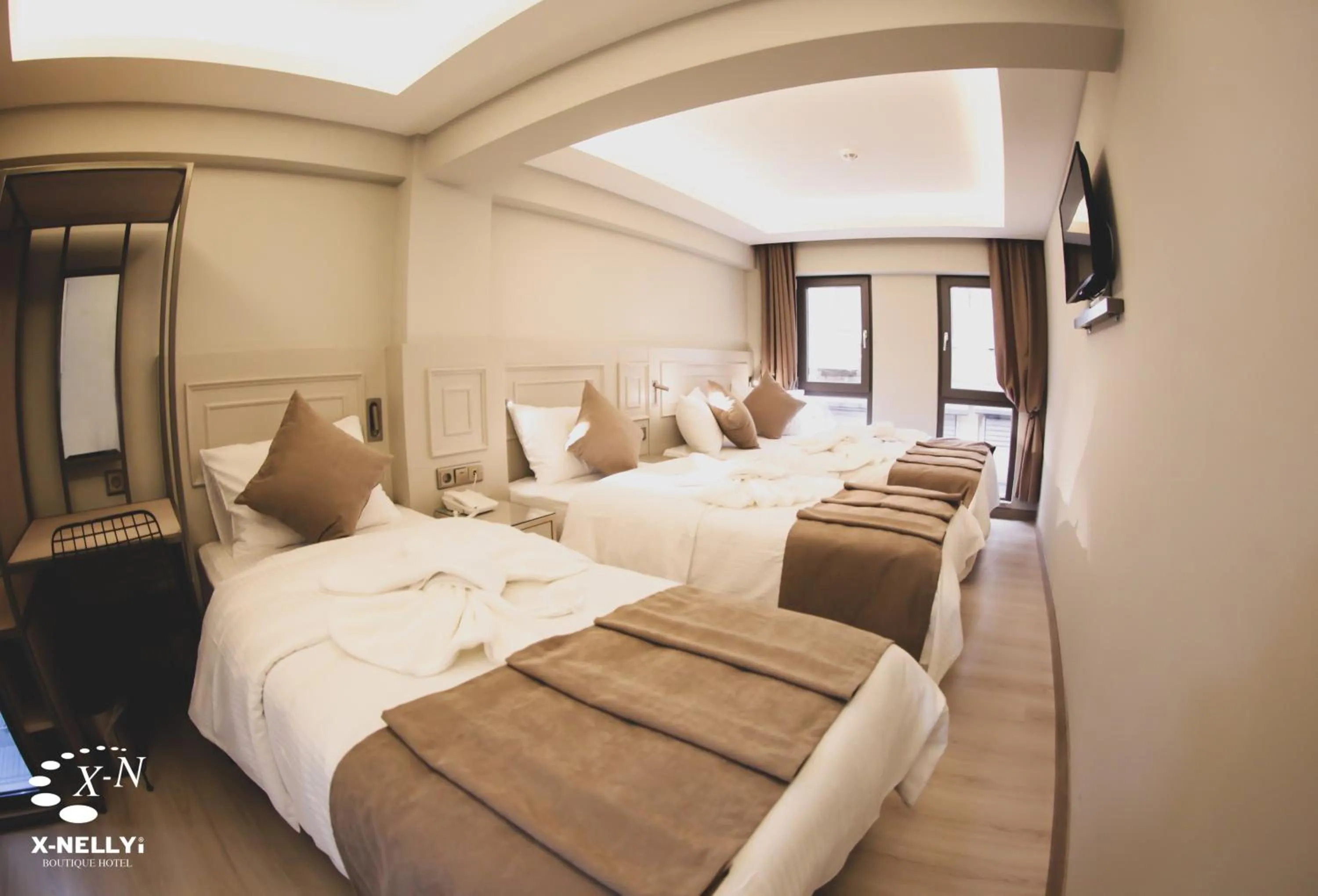 Bed in X-NELLYİ HOTEL