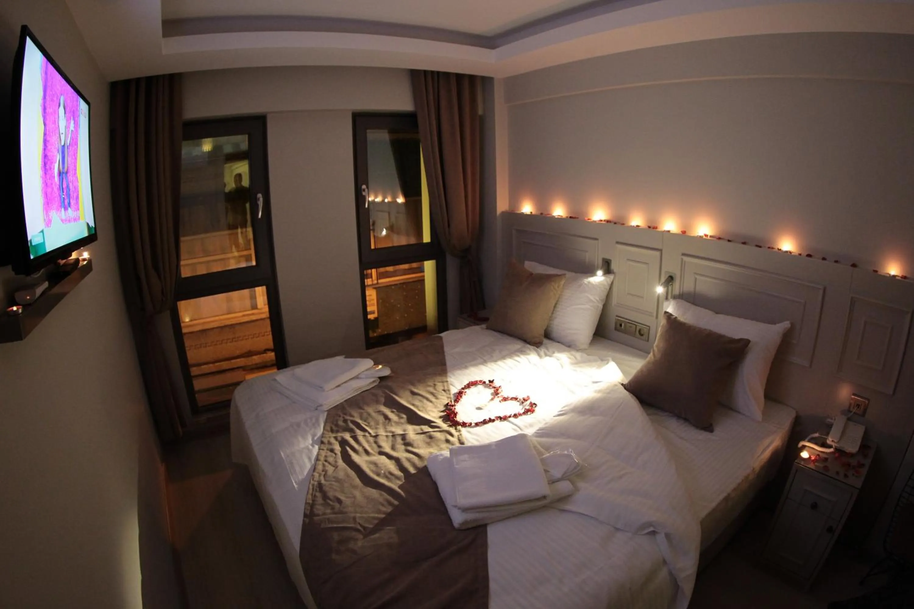 Bed in X-NELLYİ HOTEL