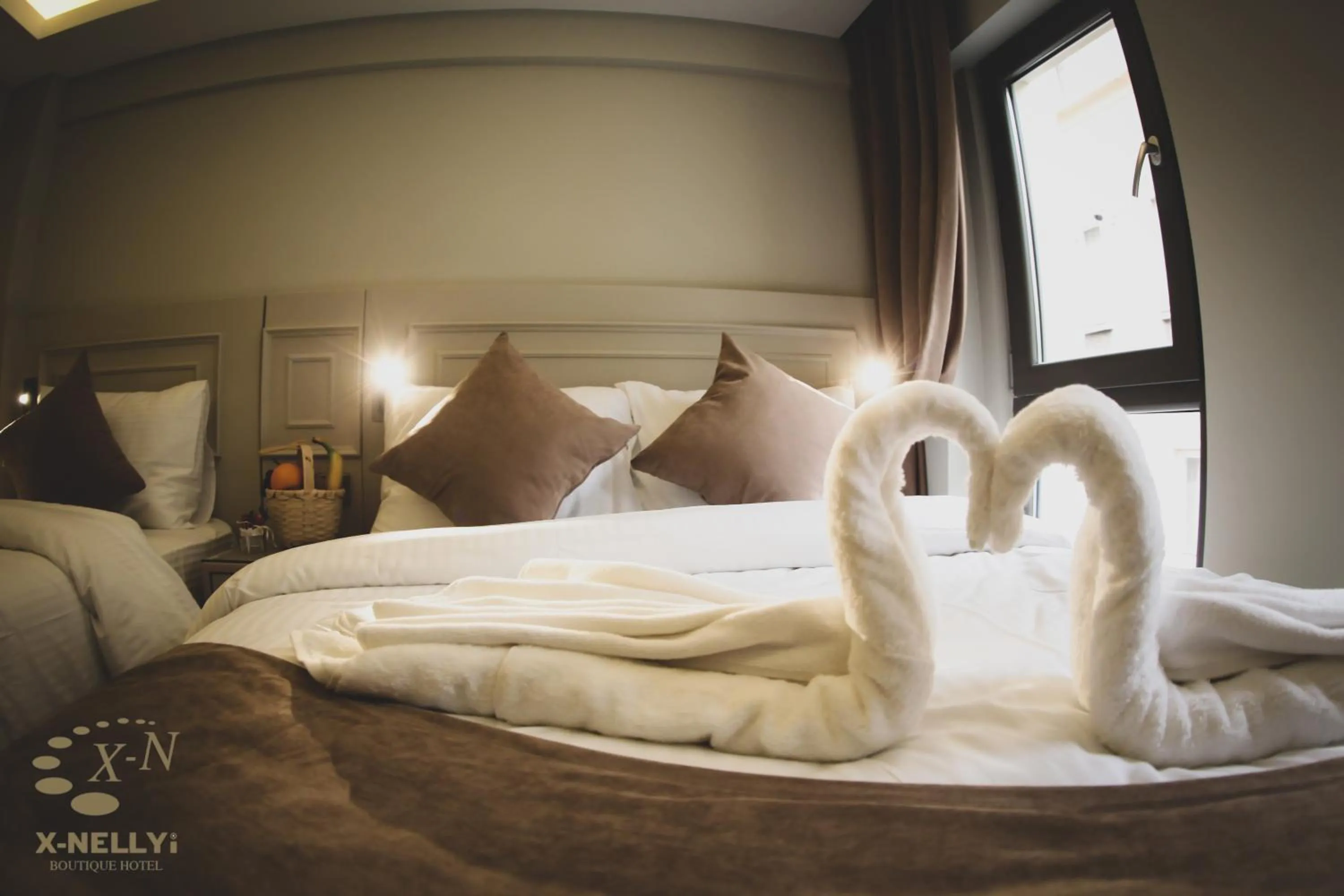 Bed in X-NELLYİ HOTEL