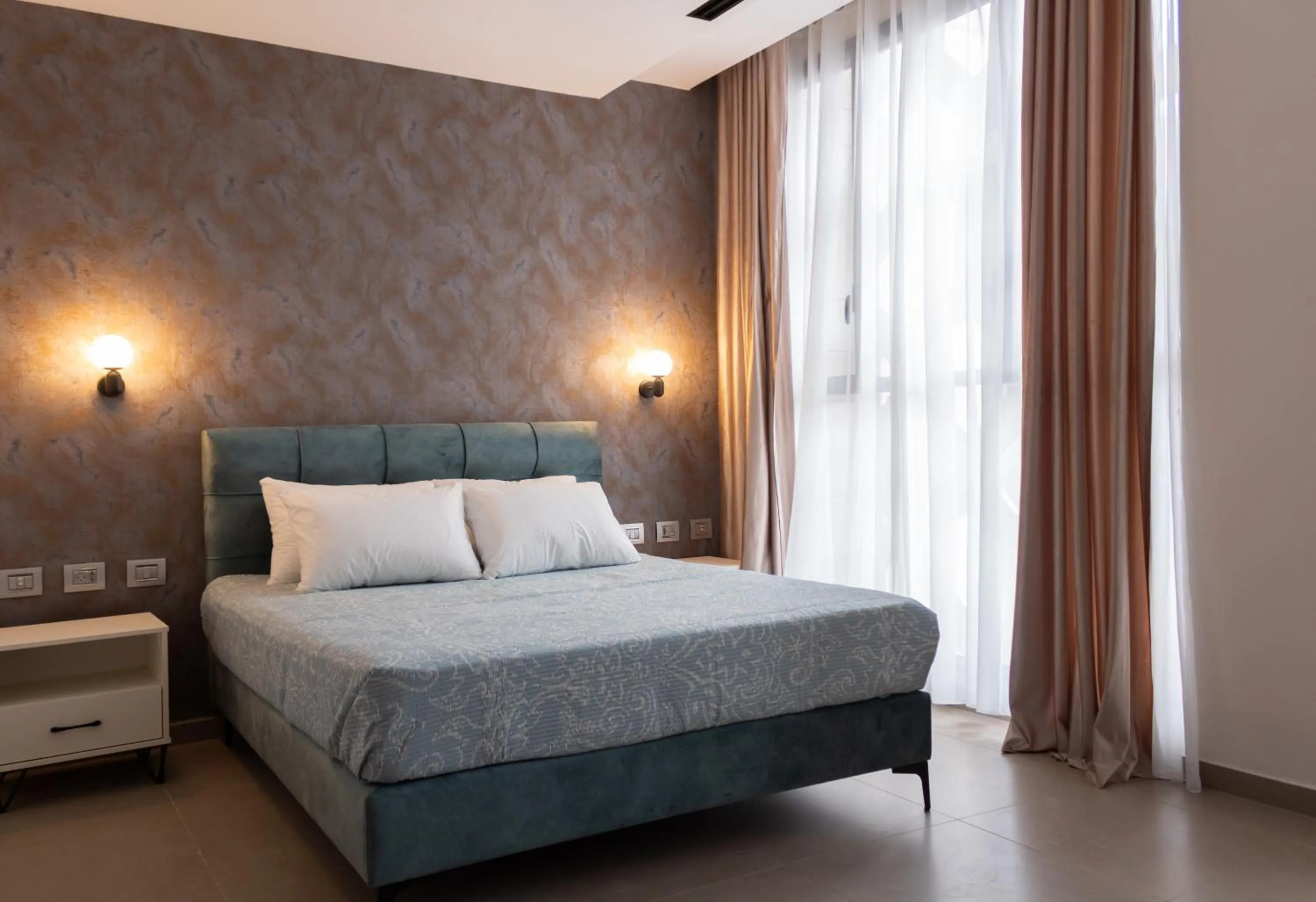 Bed in Amwaj Apartments