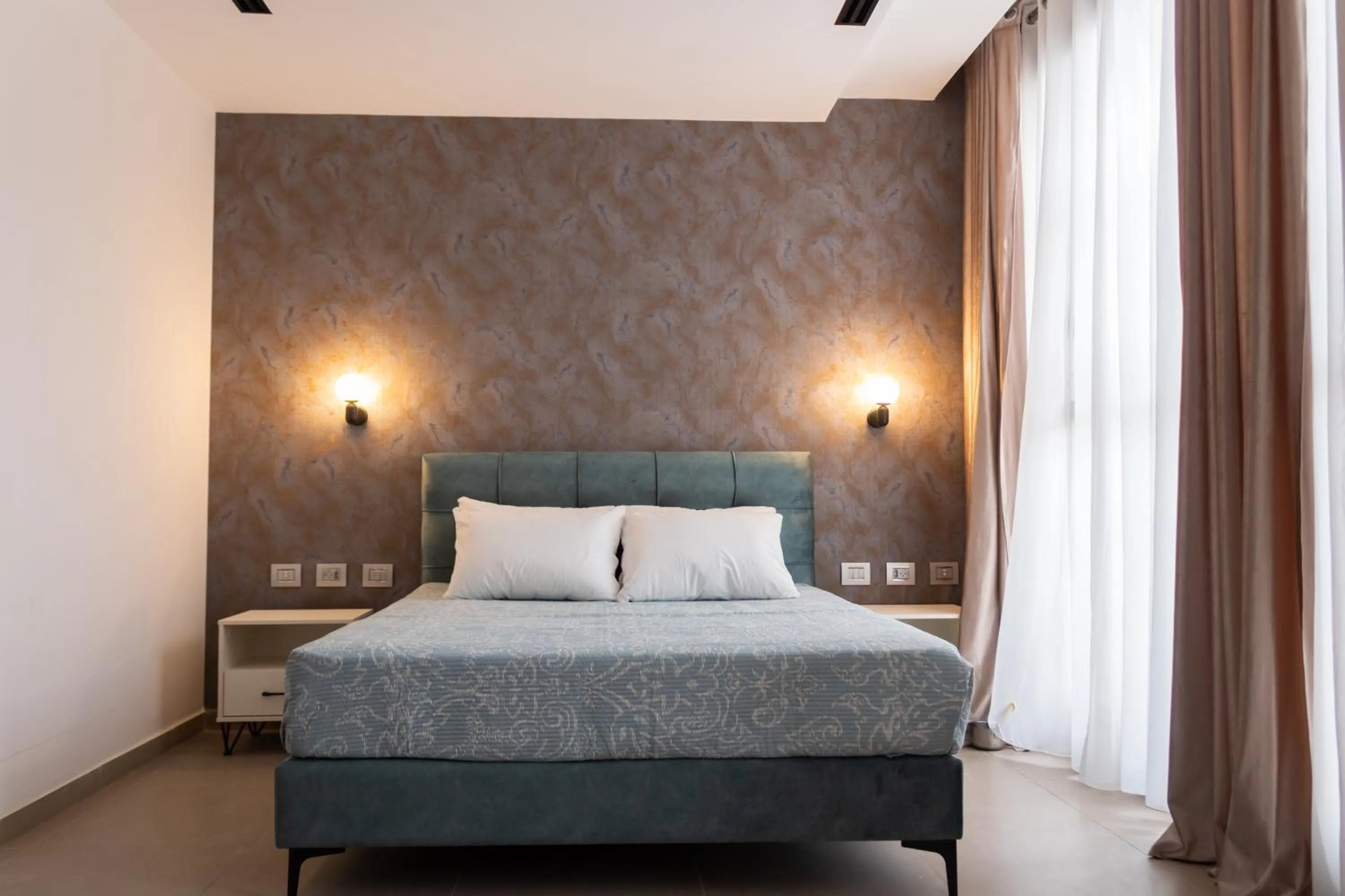 Bed in Amwaj Apartments