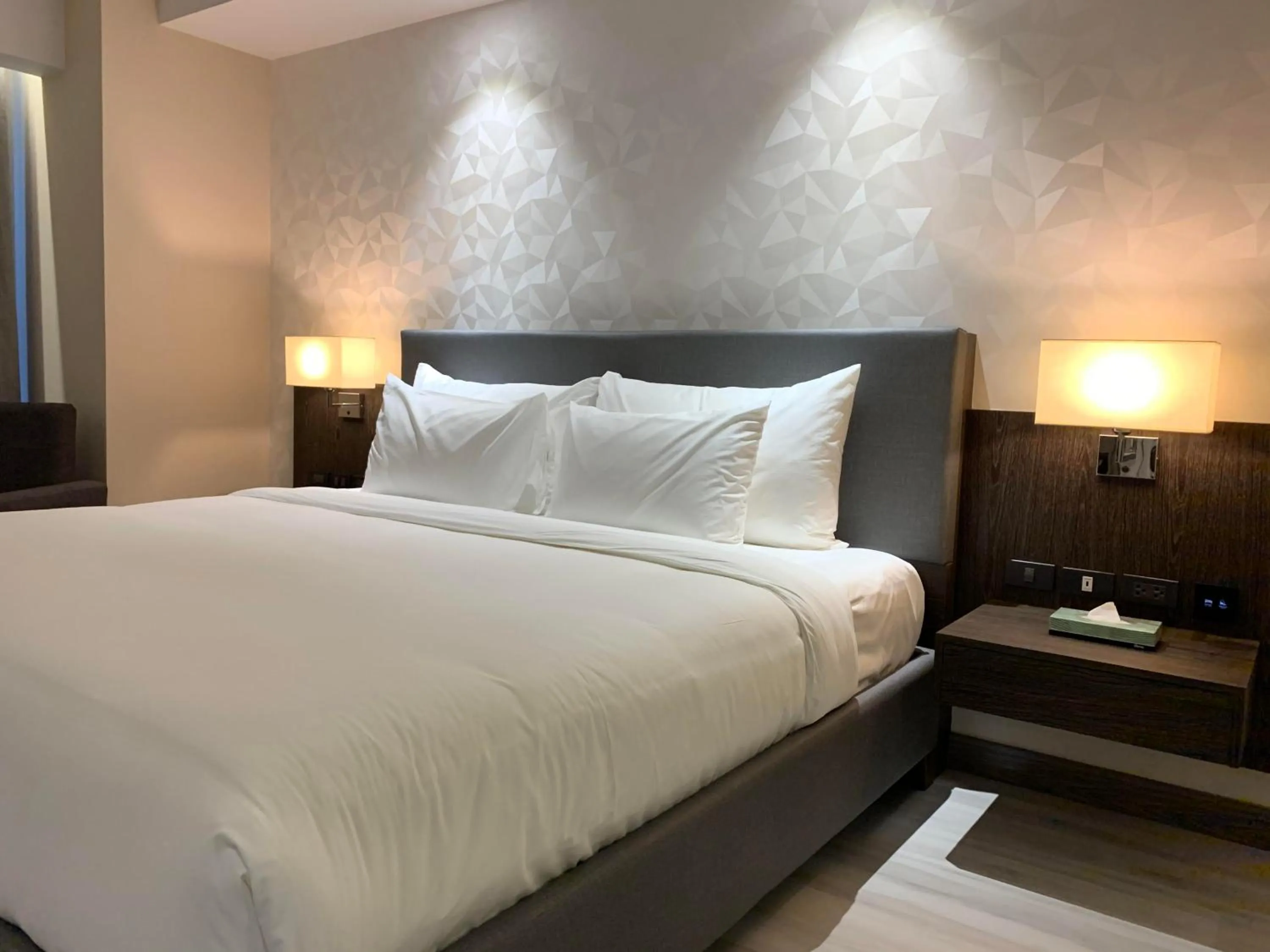 Bed in Capitol Hill Hotel and Suites