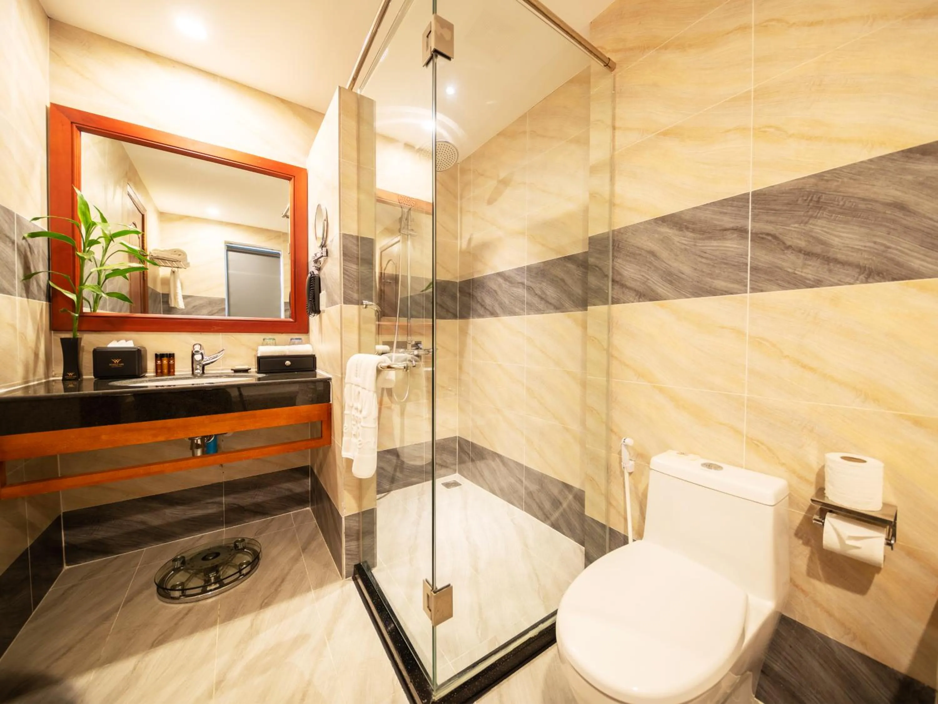 Toilet in Poulo Wai Hotel, Trademark Collection by Wyndham