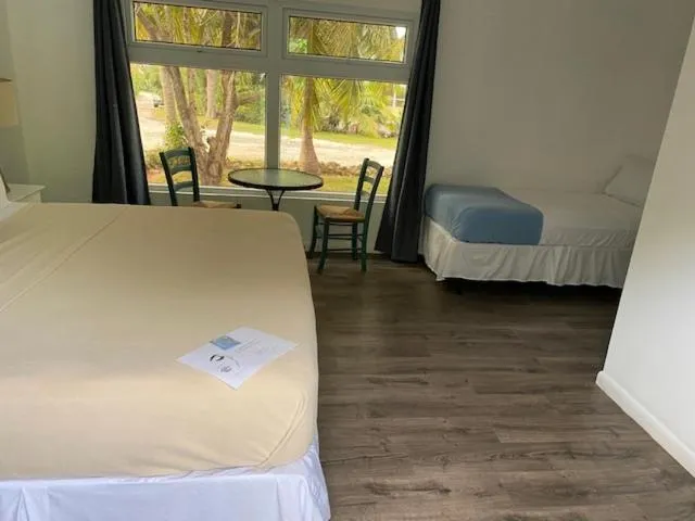 Bed in The Sunset Cove and Rainbow Room