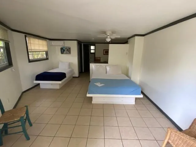 Bed in The Sunset Cove and Rainbow Room