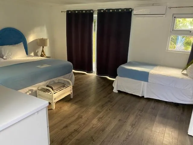 Bed in The Sunset Cove and Rainbow Room