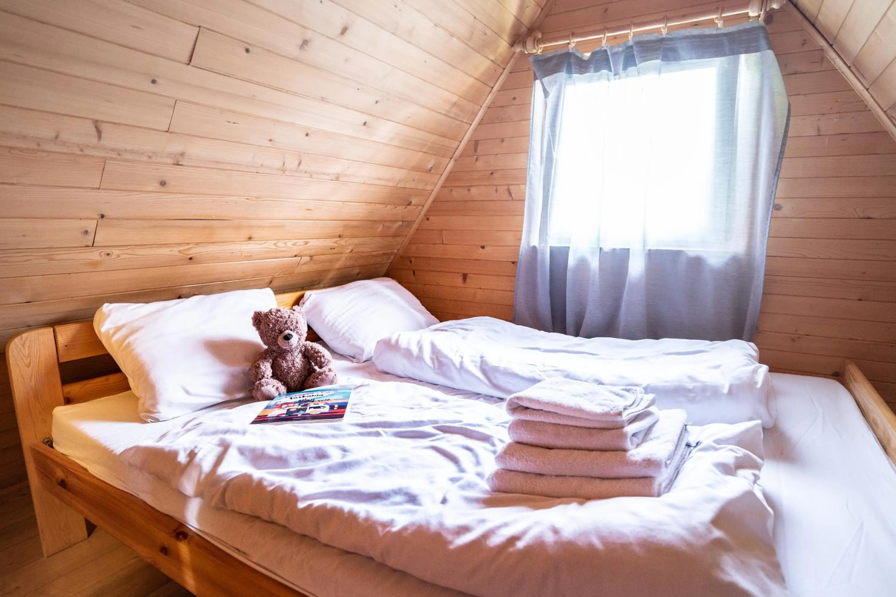 Bed in Pod Cyprysami - surf & family resort