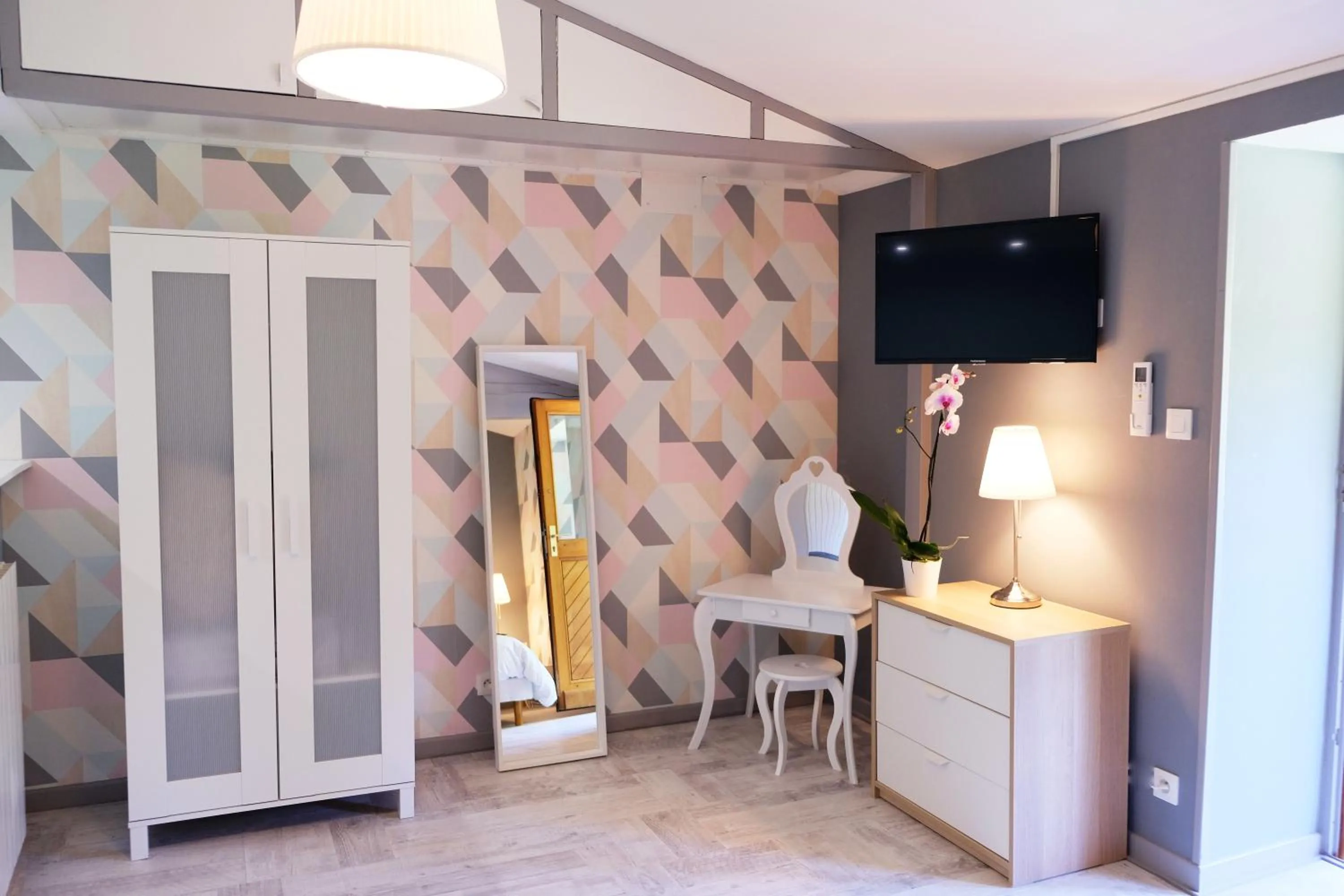 Living room in Hôtel Au Coq Dort Spa