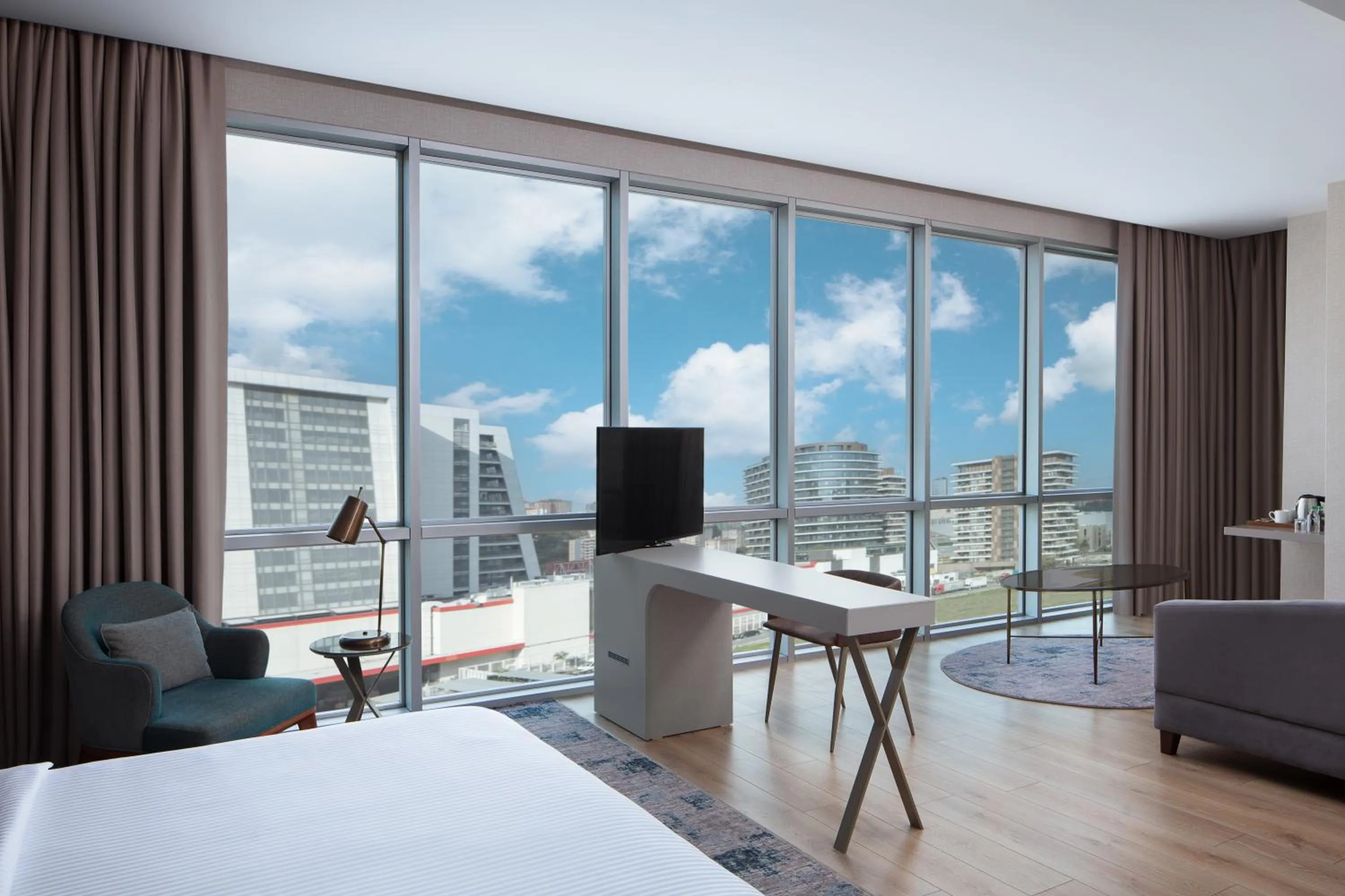 Communal lounge/ TV room, Bed in Delta Hotels by Marriott Istanbul Vadi