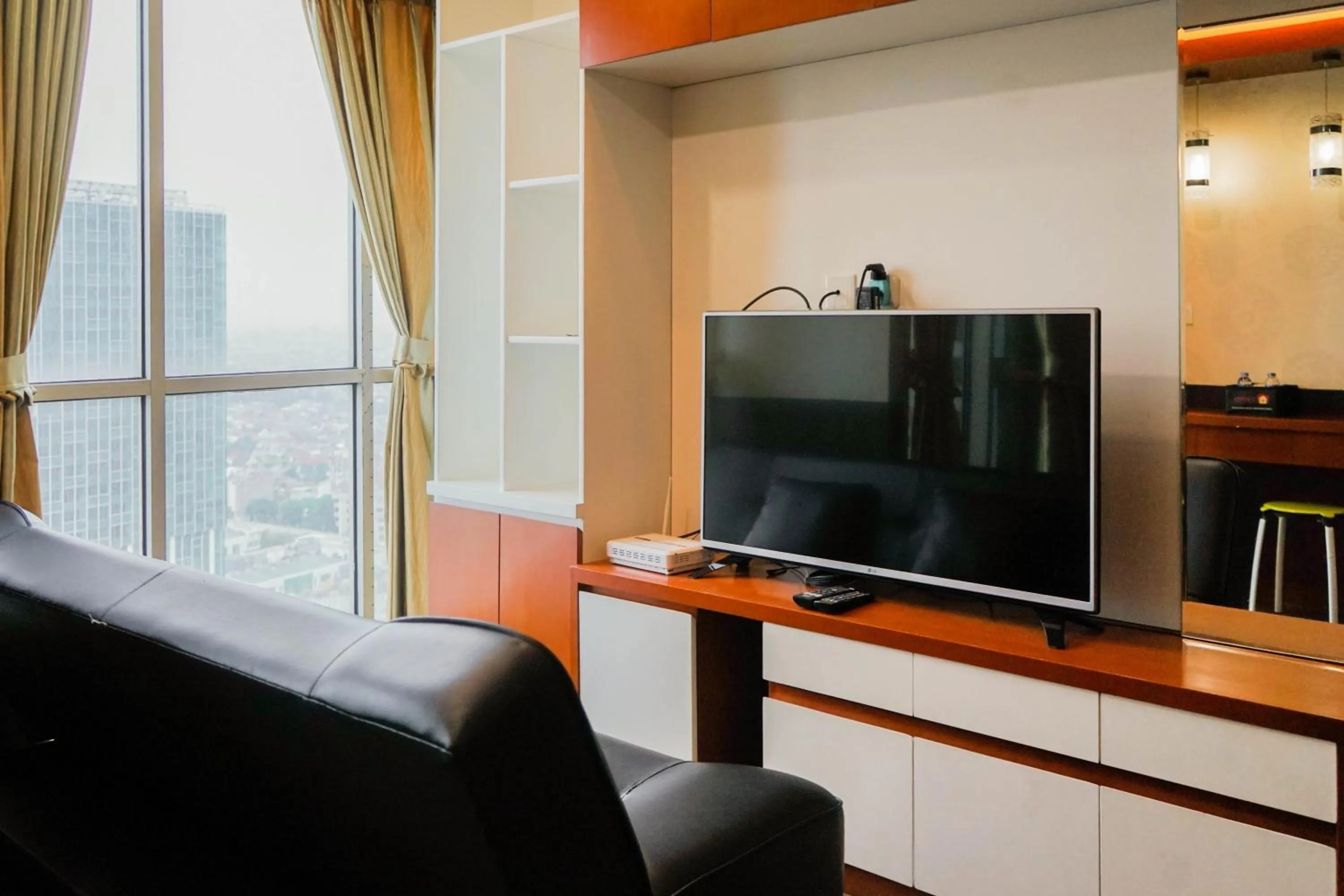 Living room in Best Price 2BR at Tifolia Apartment By Travelio