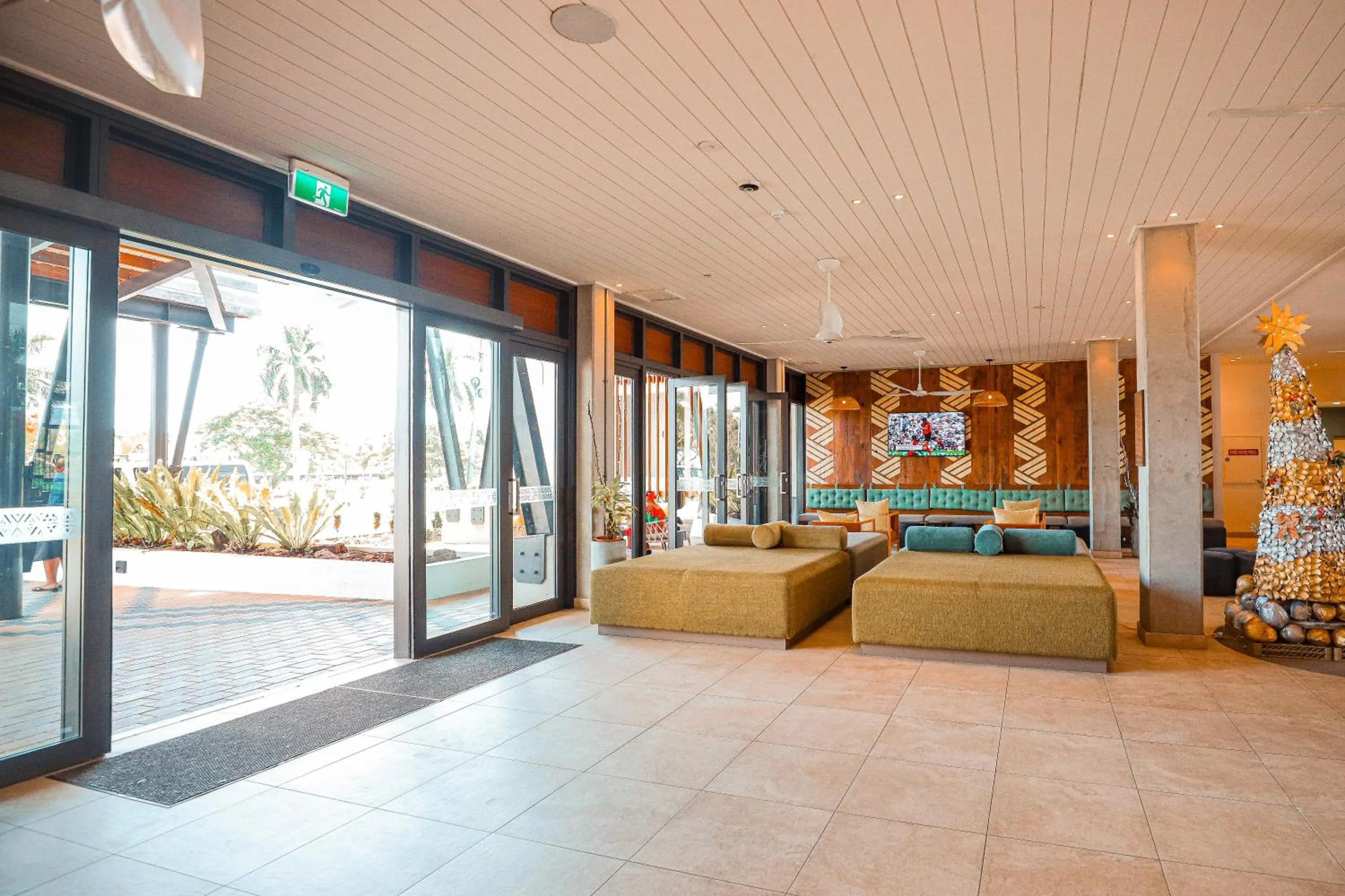 Communal lounge/ TV room, Bed in Lava Hotel