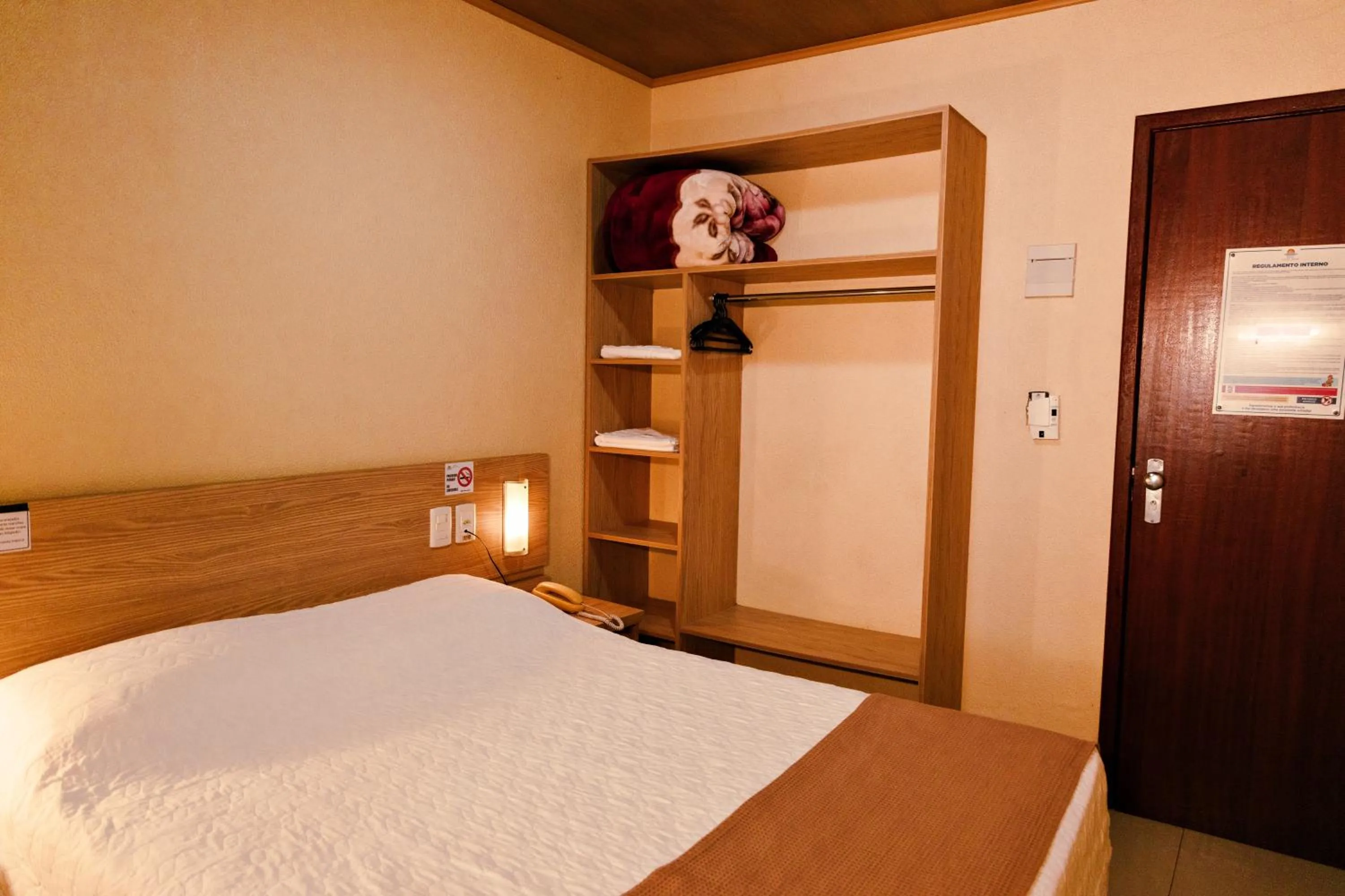 Bed in Pousada Costa Doce