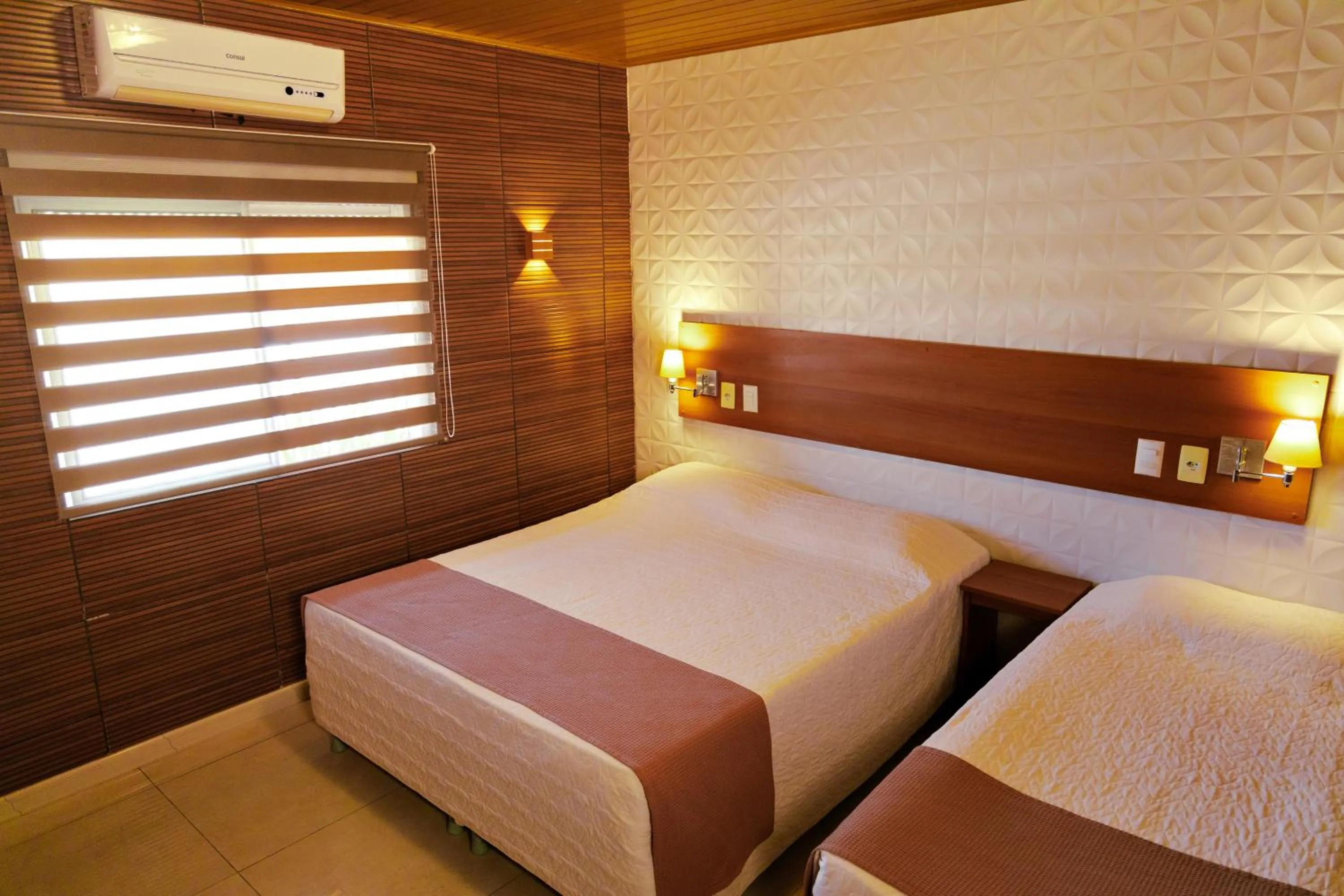 Bed in Pousada Costa Doce