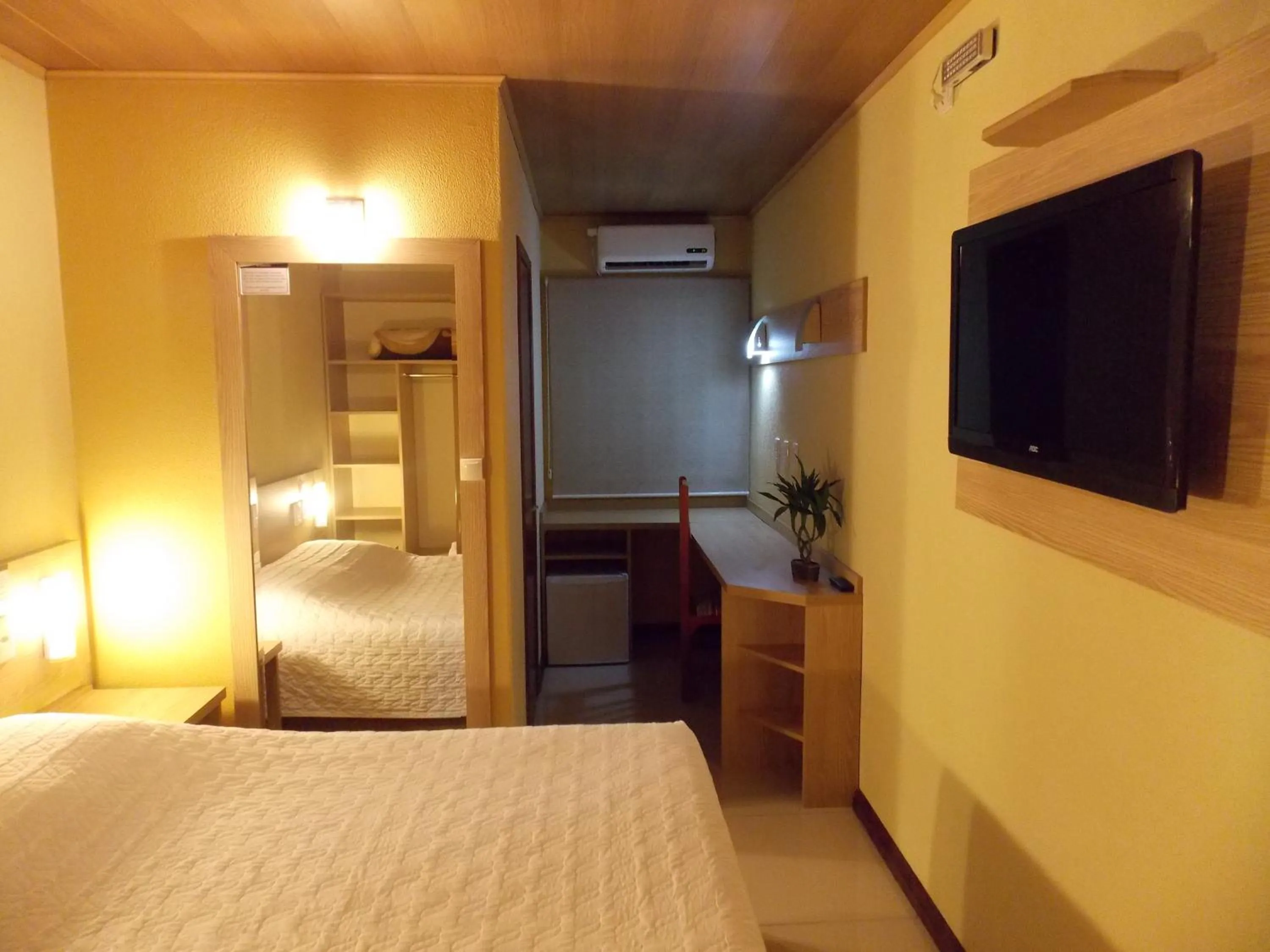 Bed in Pousada Costa Doce