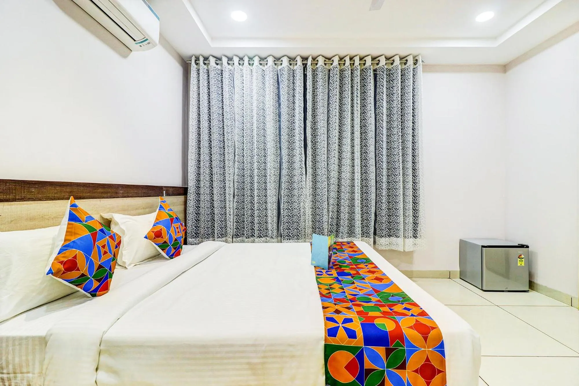 Bed in FabHotel Meera Palace