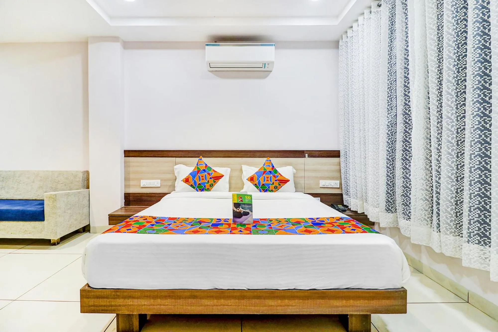 Bed in FabHotel Meera Palace