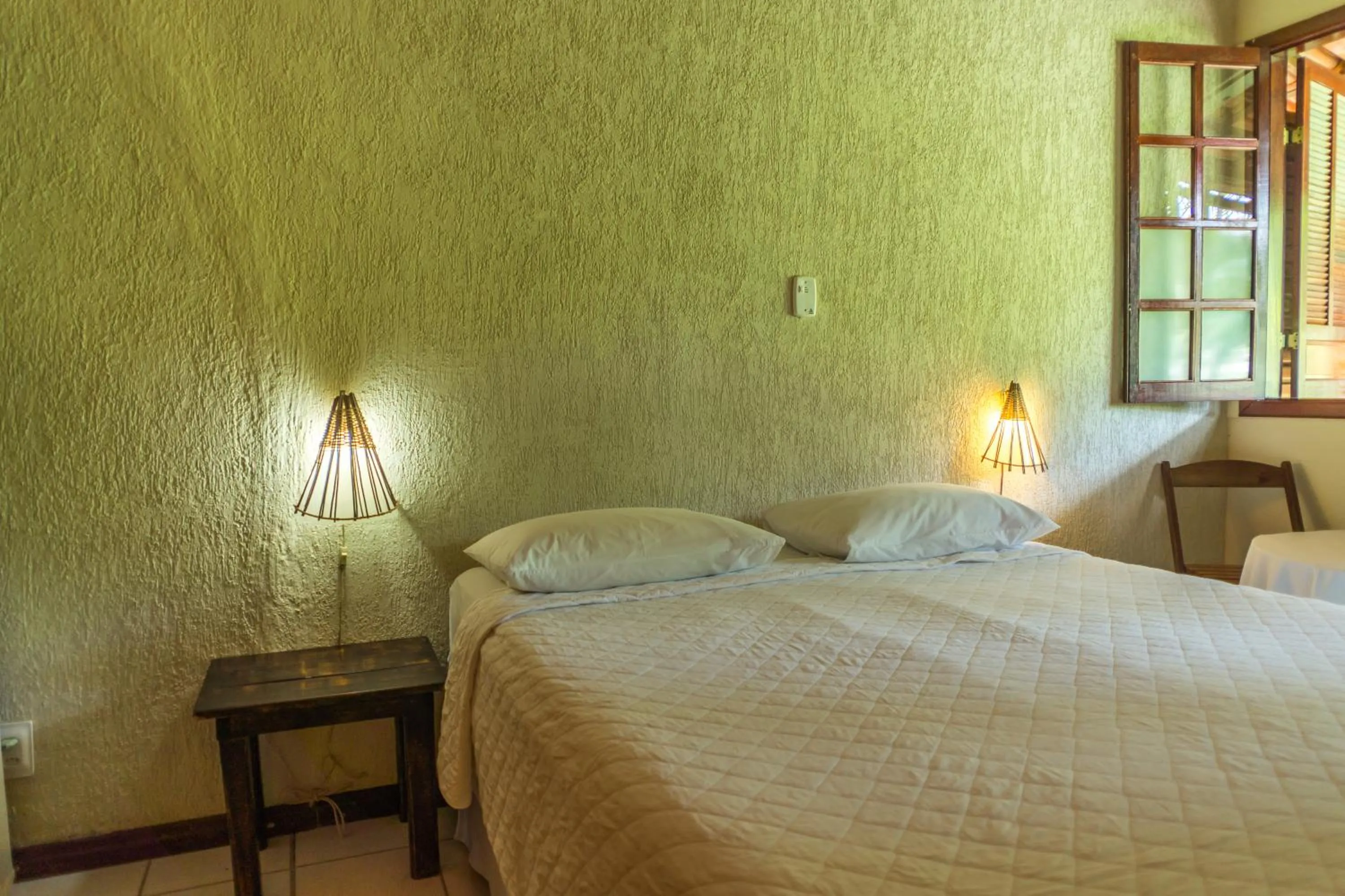 Bed in Pousada Chão da Serra