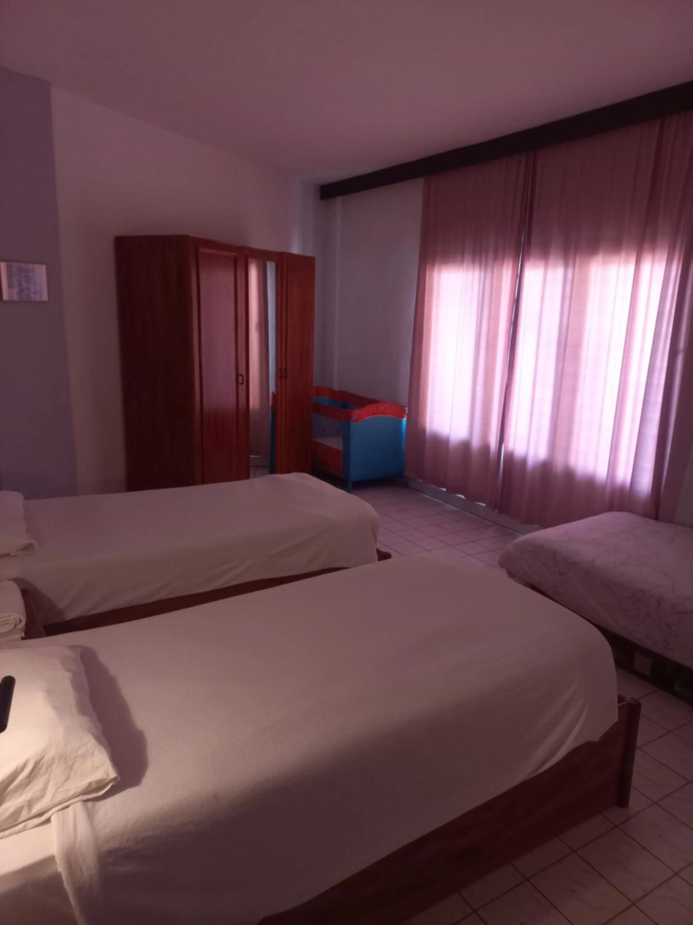 Bed in Delphin Apart Hotel